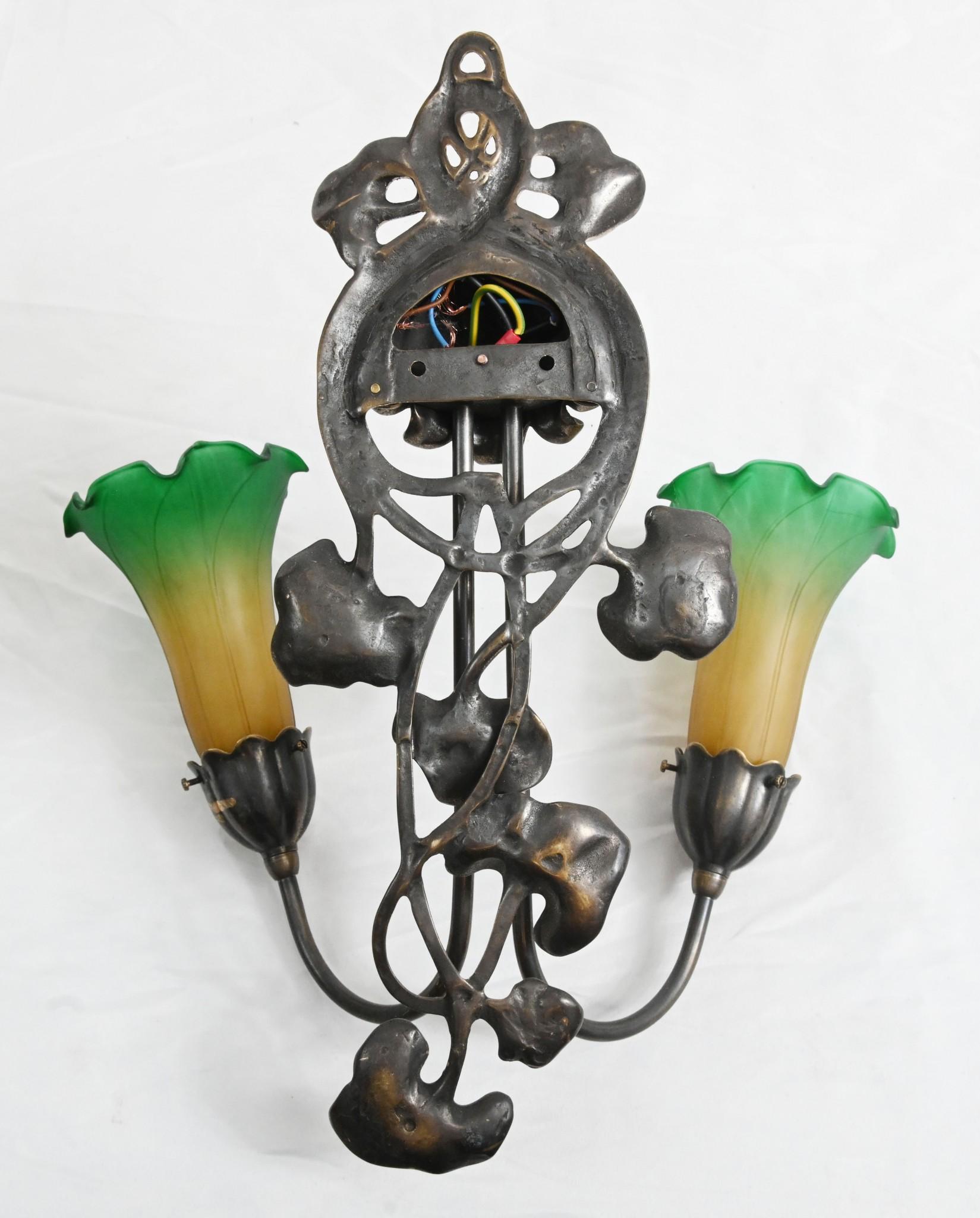 Great look to this pair of art nouveau style sconces
Made from a resin with a gold gilt finish
Two frosted glass lamps shades in green
Offered in great shape ready for home use right away
We ship to every corner of the planet - please get in touch