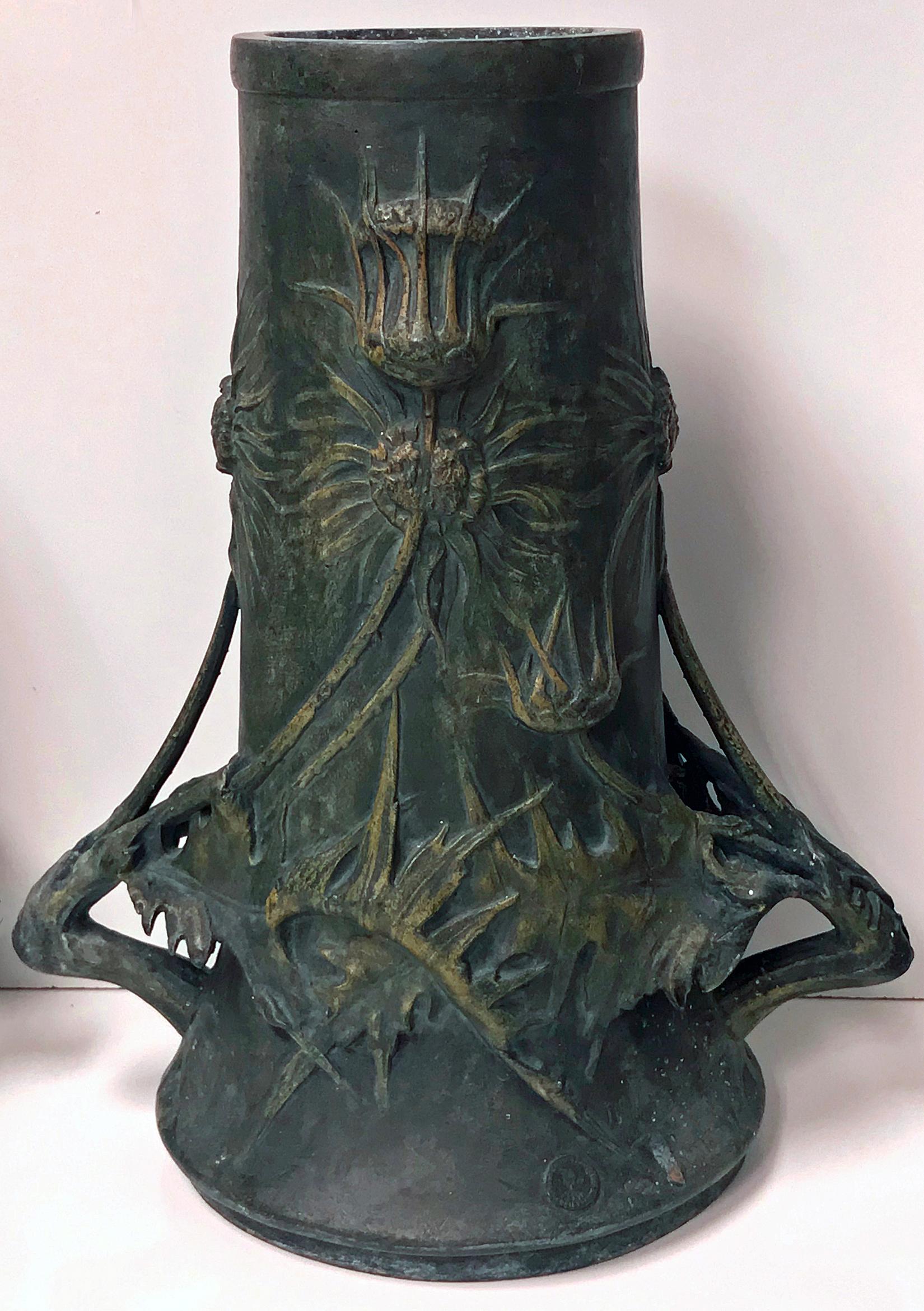 Pair of Art Nouveau vases, Blanche Poccard de Saintilau, French, circa 1900. Greenish patina bronzed surface in spelter metal, three dimensional thistle decorations; the handles conforming as thistle branches. They are signed along the edge alon