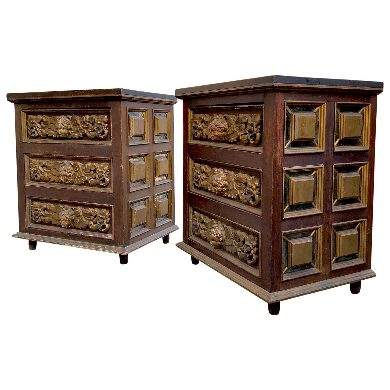 A beautiful pair of Artes De Mexico handcrafted nightstands / cabinets. Gorgeous workmanship in this pair of nightstands. 3 drawers in each with iron pulls. All carved wood with old mirror like accents to the panels on the sides. Carved and gilded