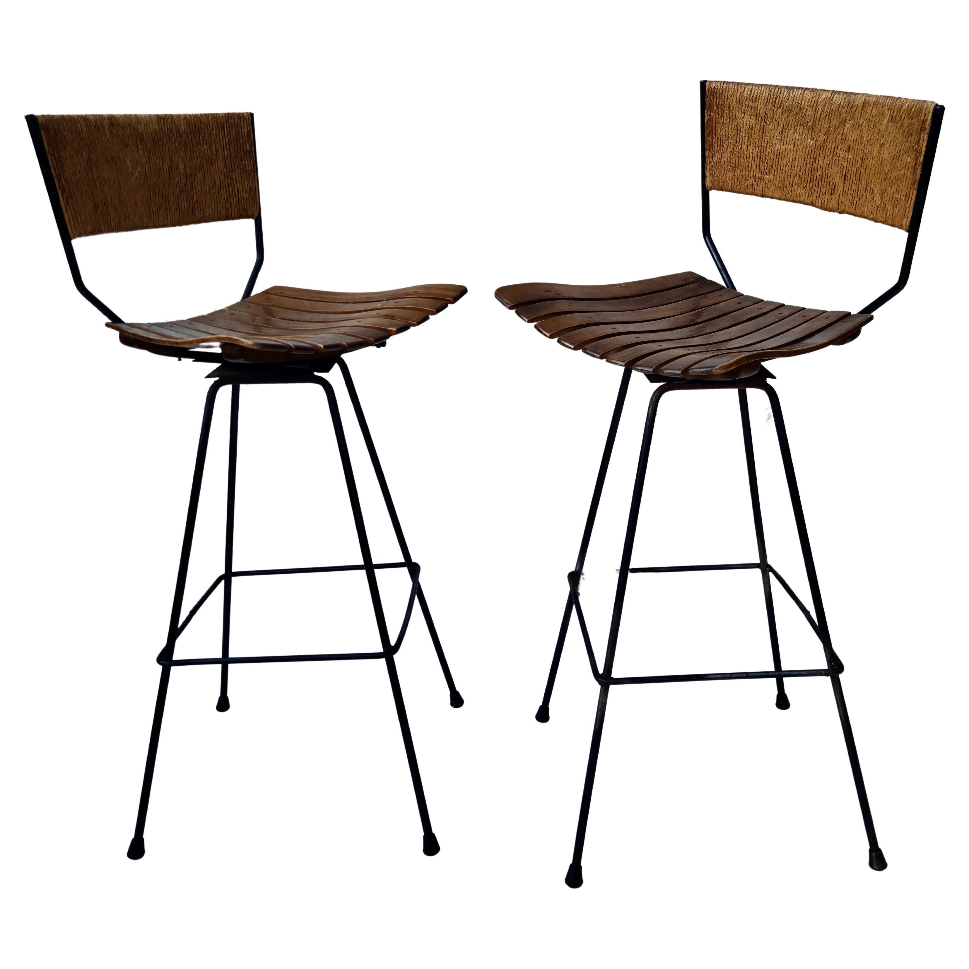 Please feel free to reach out for efficient shipping quote to your location.

Pair Swivel Bar Stools by Arthur Umanoff for Raymor.
