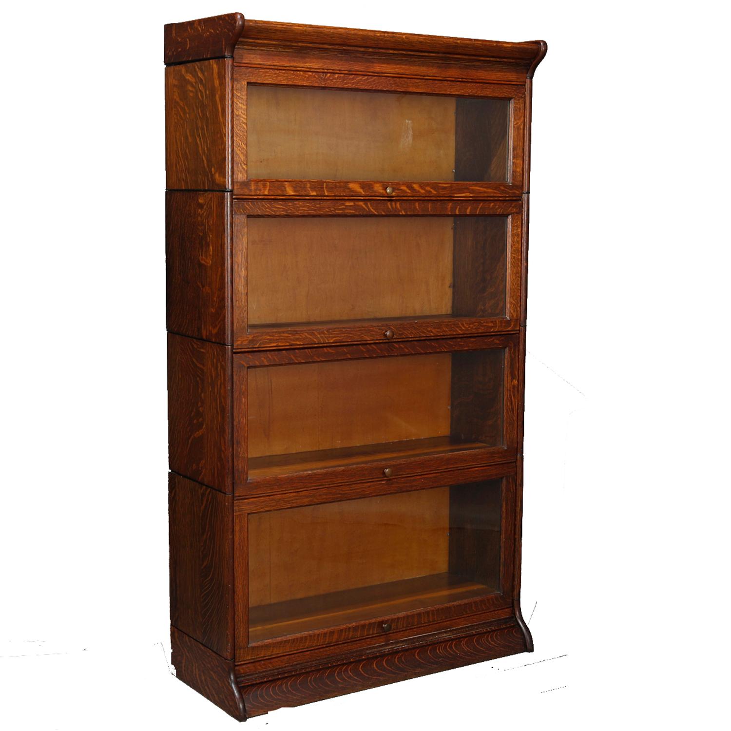 A matching pair of antique Arts & Crafts mission oak barrister bookcase offers quarter sawn oak construction each with four stacks, pull-out glass doors and original label as photographed, circa 1920

Measures - 61.5