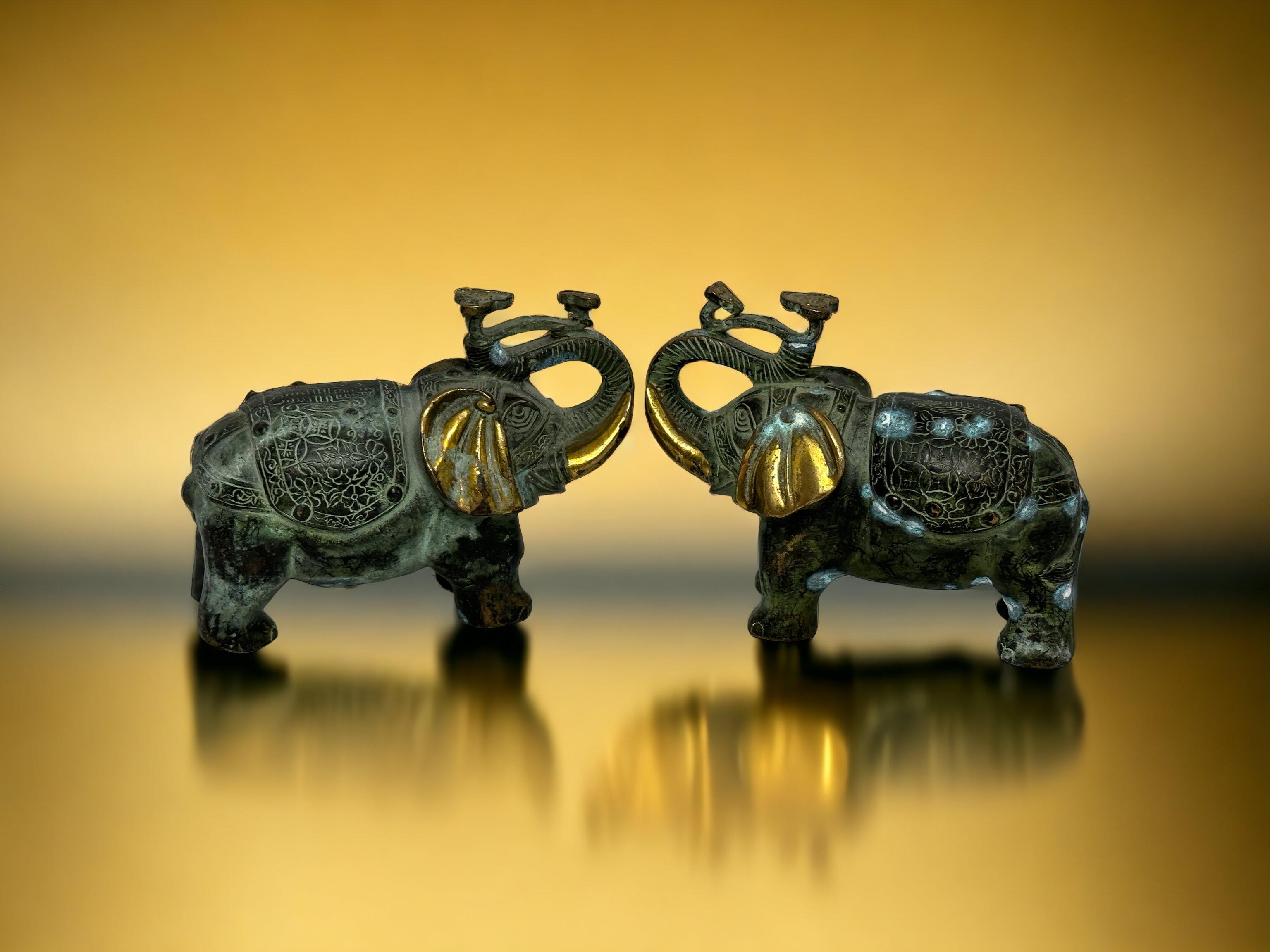 A decorative hand made pair elephant sculptures or statues. Some wear but this is old-age. Made of brass or bronze. We think it is from Asia and was made in the mid-20th century. Very Decorative and a nice addition to any collection. Size given in