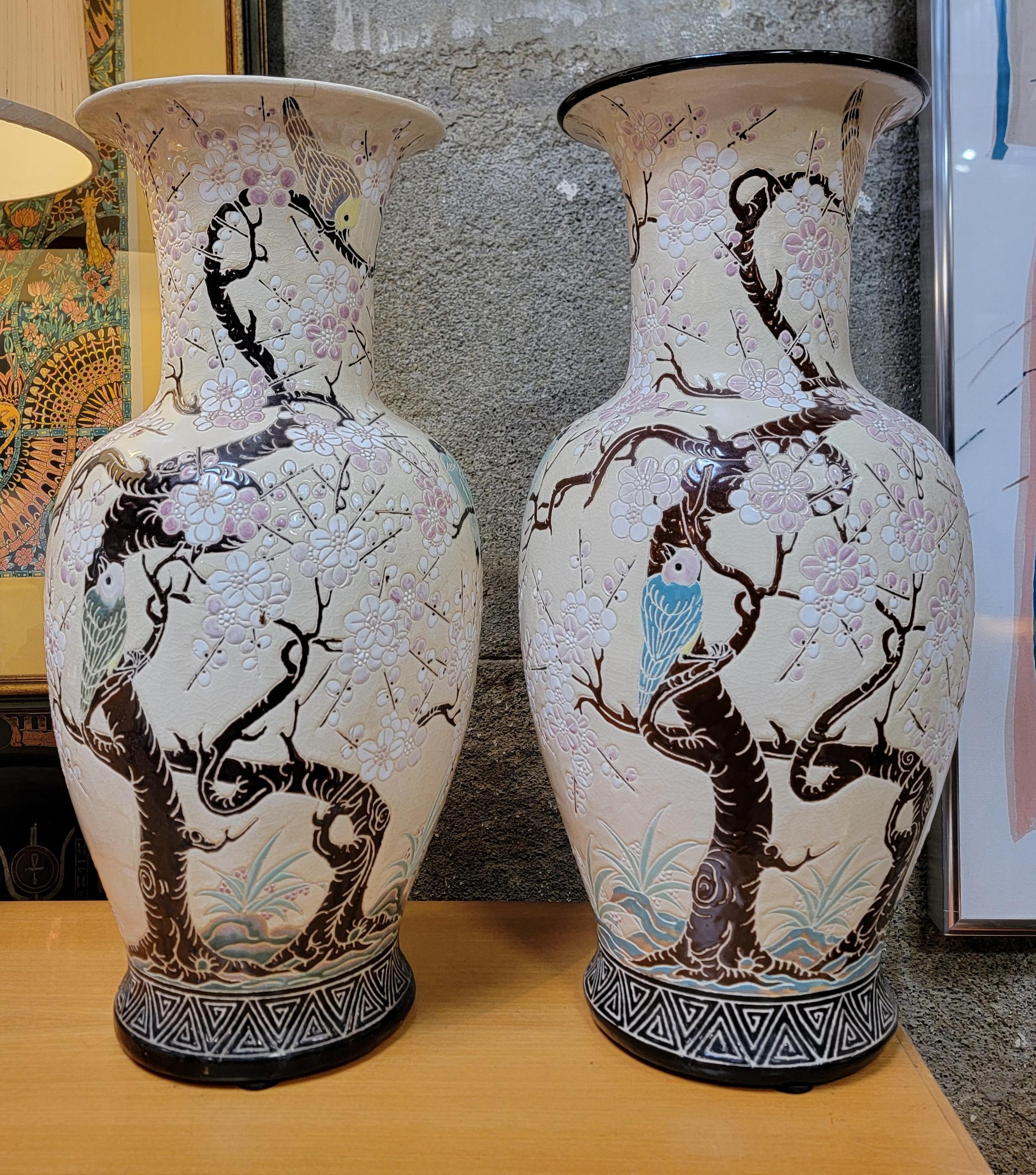 A pair of ceramic floor jars by Dona, Vietman. Circa. 1970. Bird and branch design. (notice one has painted rim, one does not)

Height 24 in.