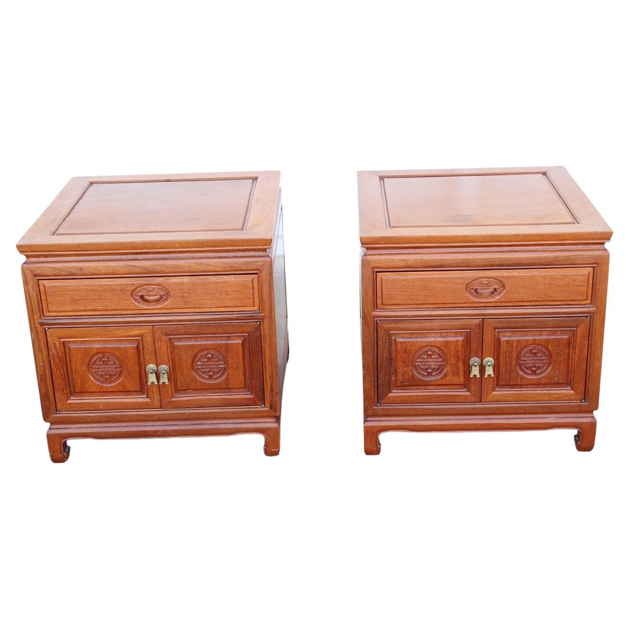 Pair Chinosarie Nightstands
1990s


Pair of beautifully carved bedside cabinets from Asia. Rosewood with bronze pulls.
One drawer with concealed shelving below.
 

Height: 22