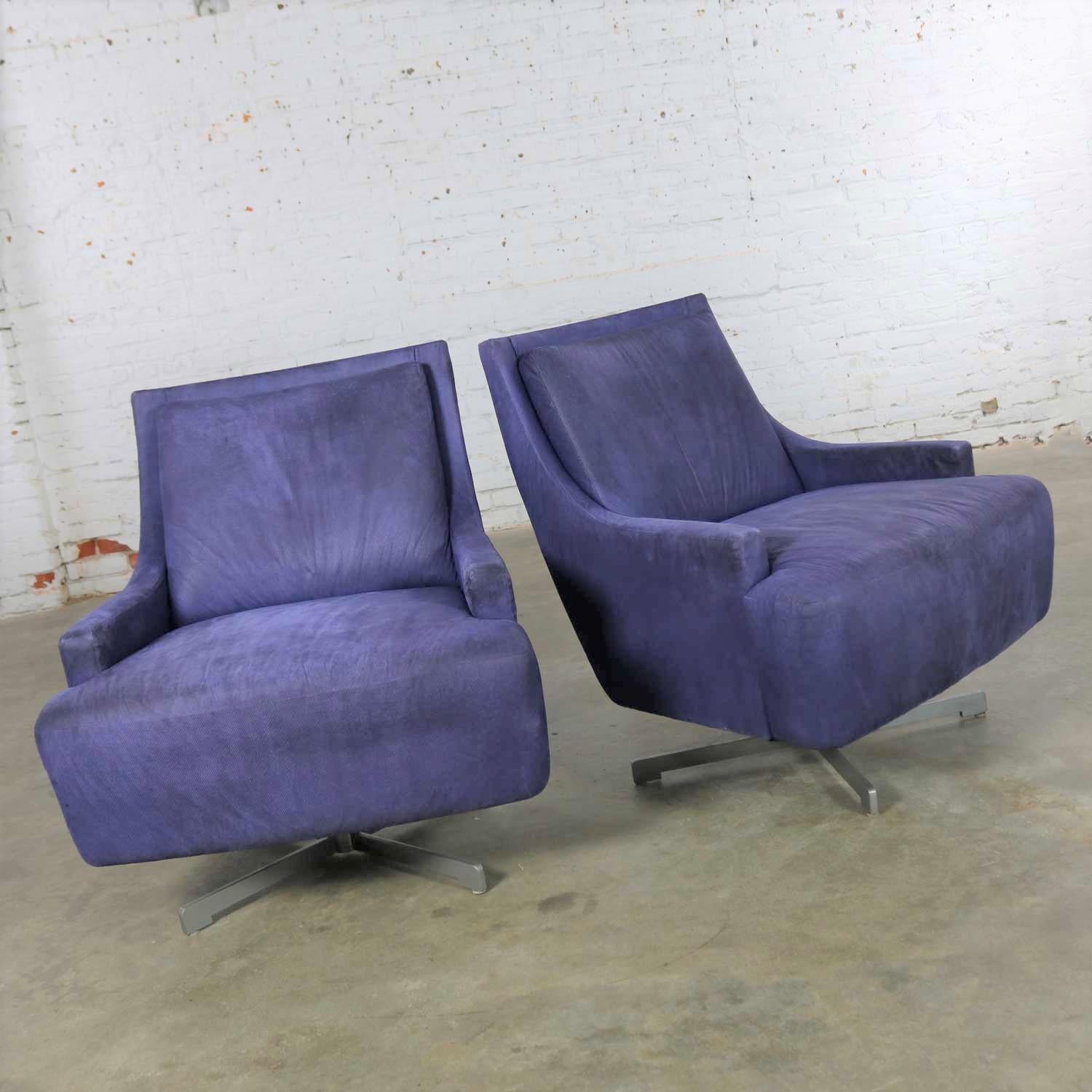 Handsome pair of Scoop swivel lounge chairs with a metal base by Barbara Barry for HBF. This pair is in wonderful vintage condition as far as the base, frame and stability are concerned. However, the aubergine colored upholstery, even though we have