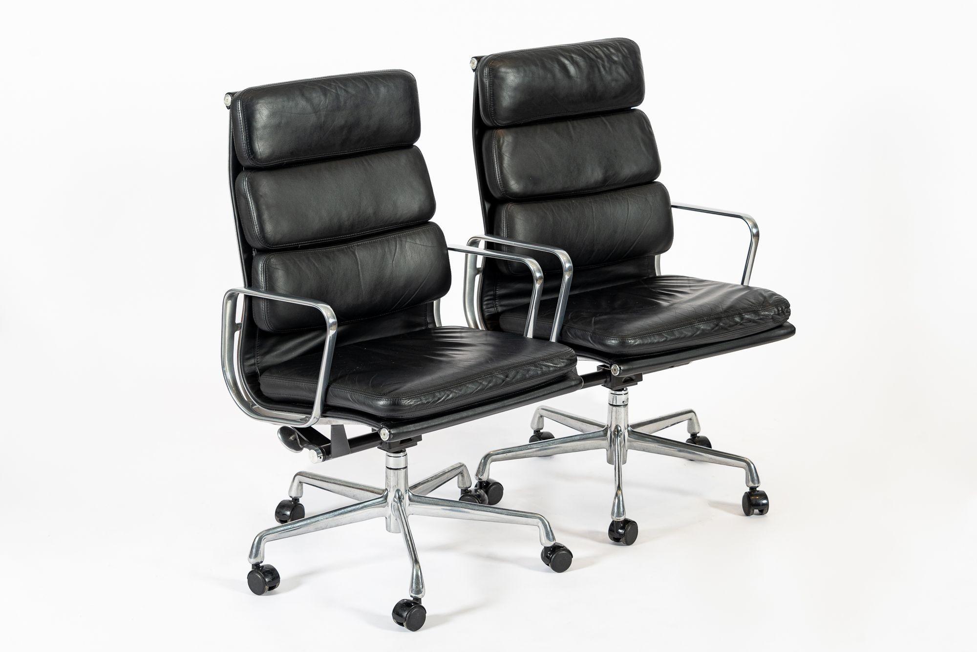 These authentic Eames for Herman Miller Soft Pad Executive Height office chairs from the Aluminum Group Collection were manufactured in 2001. These executive height chairs feature a taller backrest, original black leather upholstery, polished