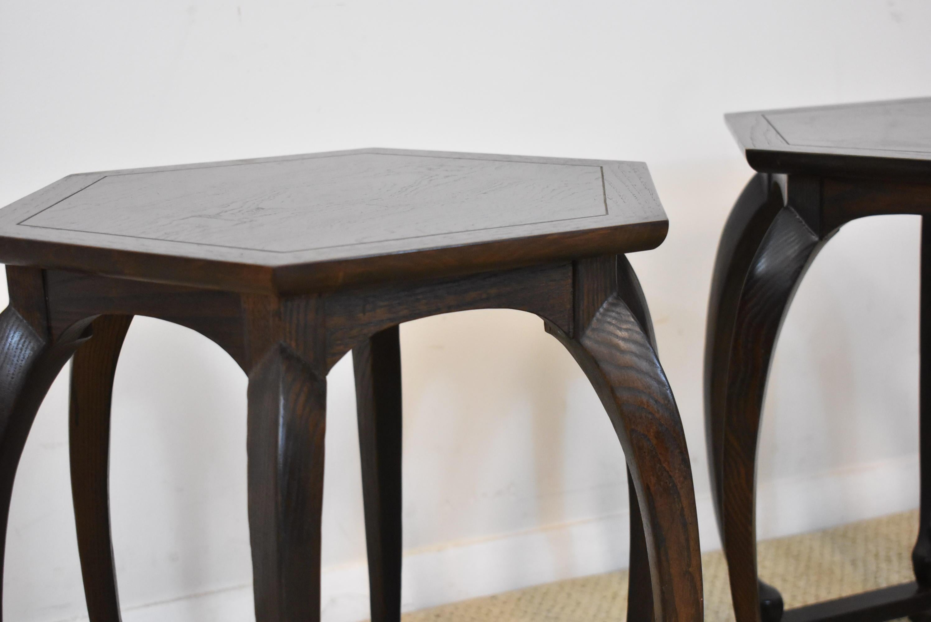 Pair of baker Furniture Asian style dark large grain stands. Hexagon in shape with pieced top.