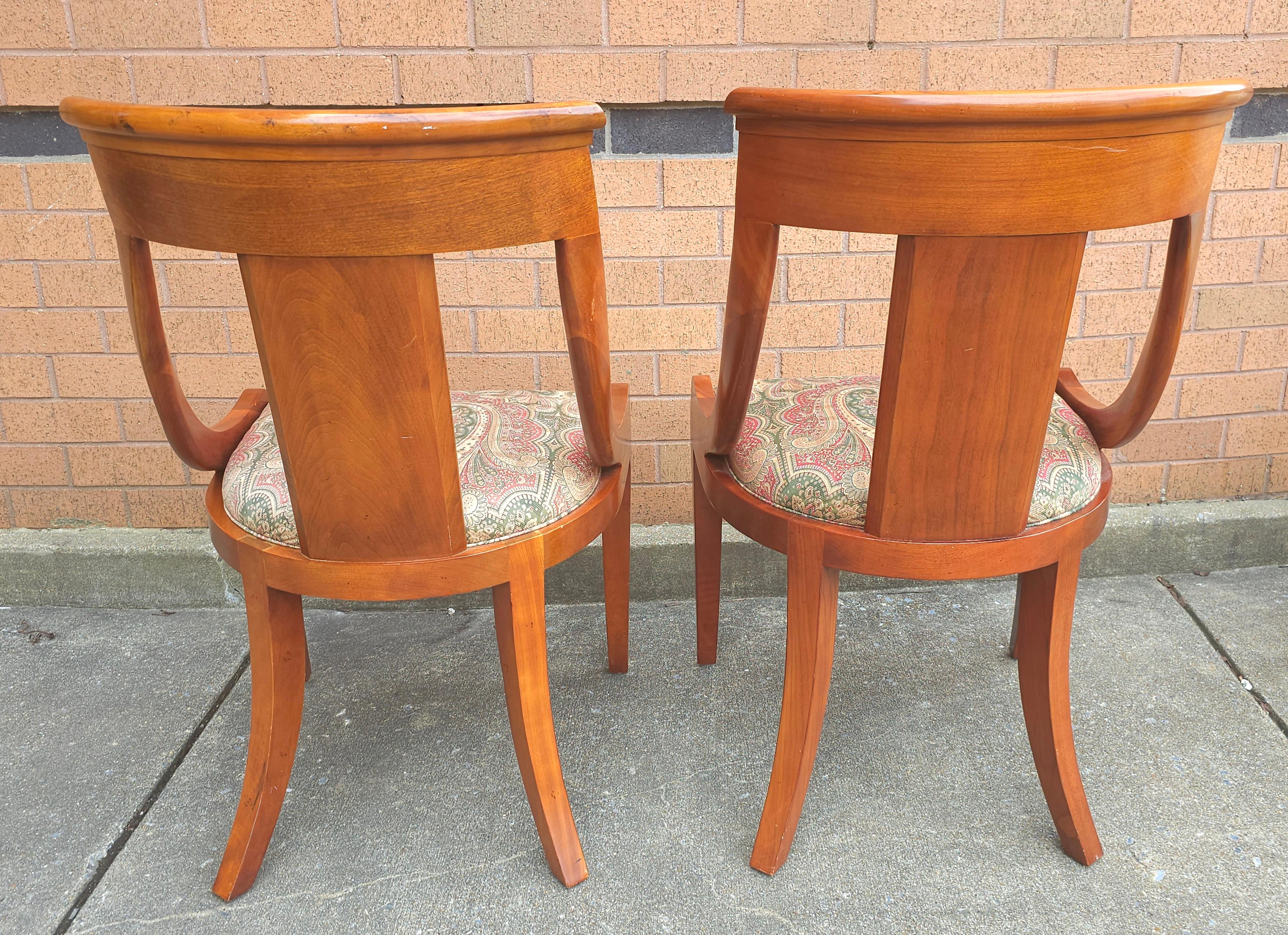 Pair of Baker Furniture Beidermeir Klismos Style Cherry Dining Chairs. A fantastic combination of the traditional Biedemeier and the Klismos styles chairs. This listing is for the pair and there 2 pairs available, We have another set of 6 side