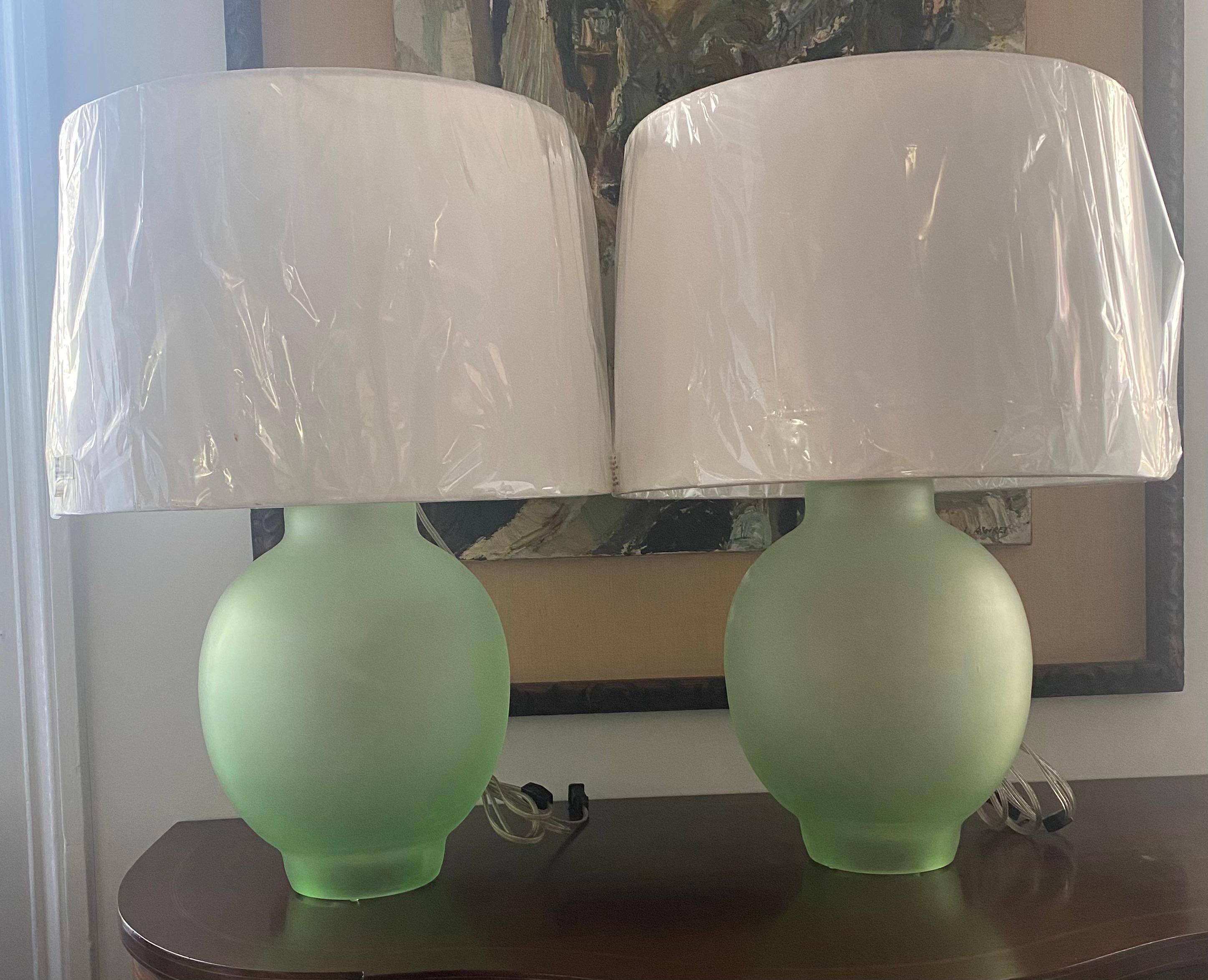 Amazing pair of frosted green table lamps - glass body is approx 11 inches diameter x 15 inches high plus 10-14 inch adjustable shade holder.
Shades photographed measure approx 18 inches diameter x 13 inches high.
Shades can be included but add to