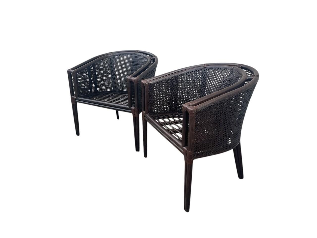 Pair Baker-McGuire Barrel Chairs with bent rattan frames and double honeycomb caning and rawhide bindings
** Seat Height is 16