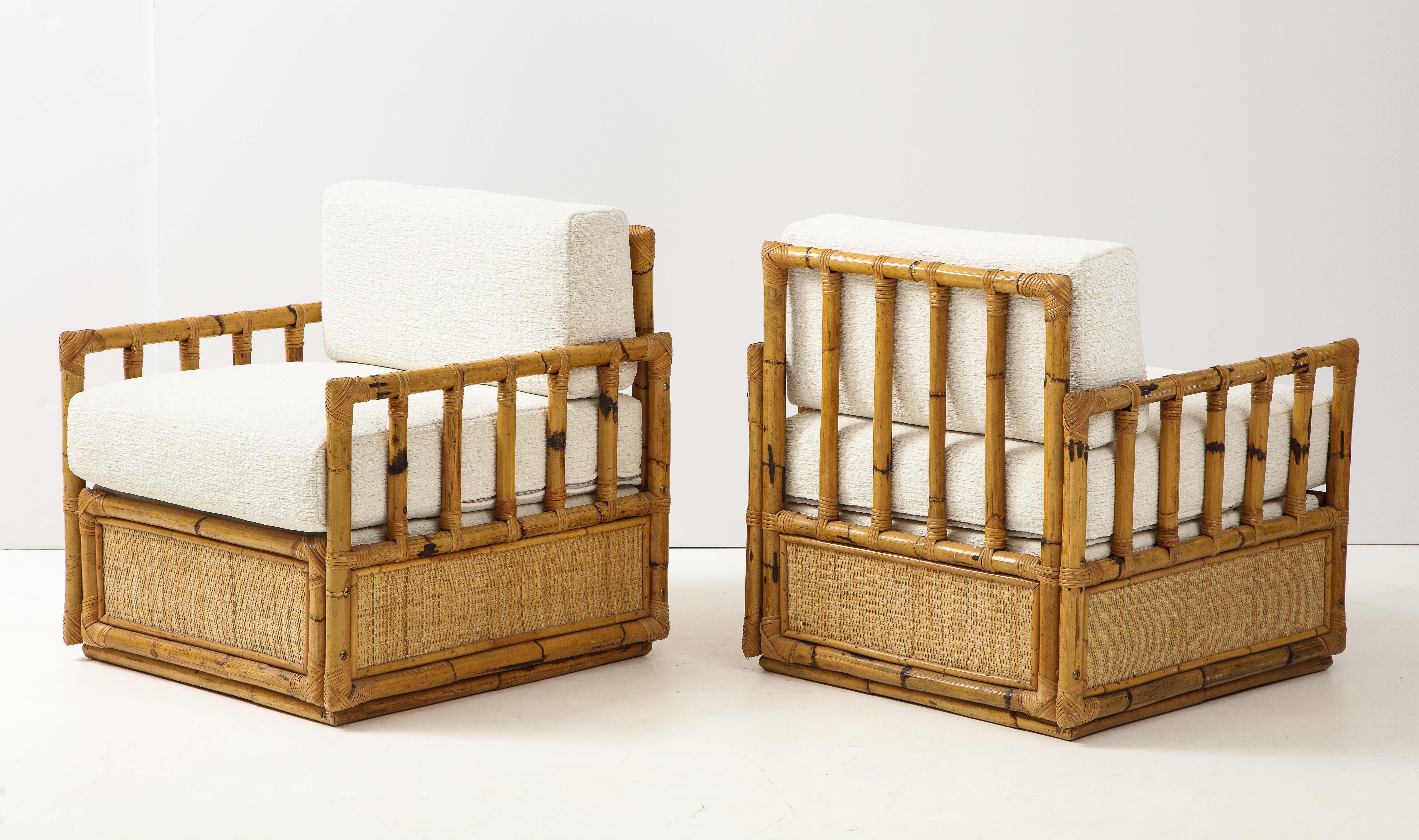 Rare pair of bamboo and rattan lounge chairs by Vivai del Sud, circa 1970. These lounge chairs are in excellent condition and have been newly updated with seat and back cushions upholstered in Ivory boucle fabric by Dedar. Vivai del Sud was a Roman