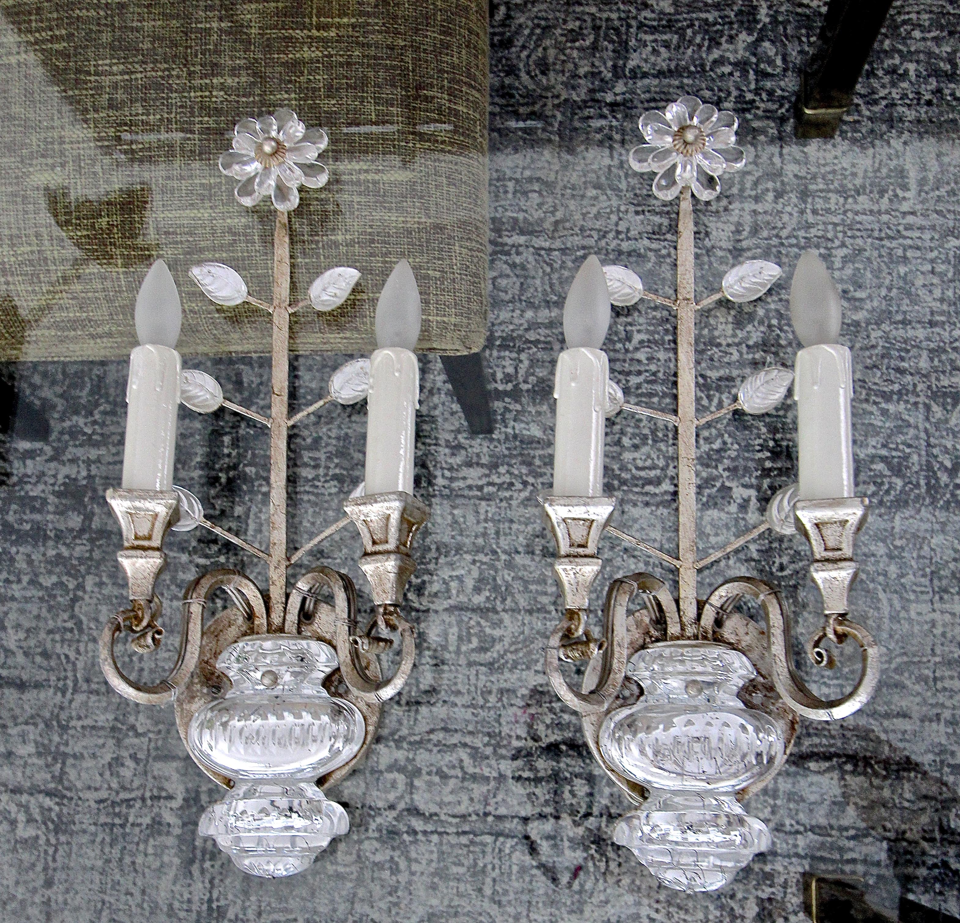 Pair of silver antiqued gilt iron sconces with crystal flower plus leaves and urn motif by Banci Firenze of Italy. Each sconce uses two candelabra base bulbs. Style of the sconces In the manner of Maison Baguès. Newly rewired for US.