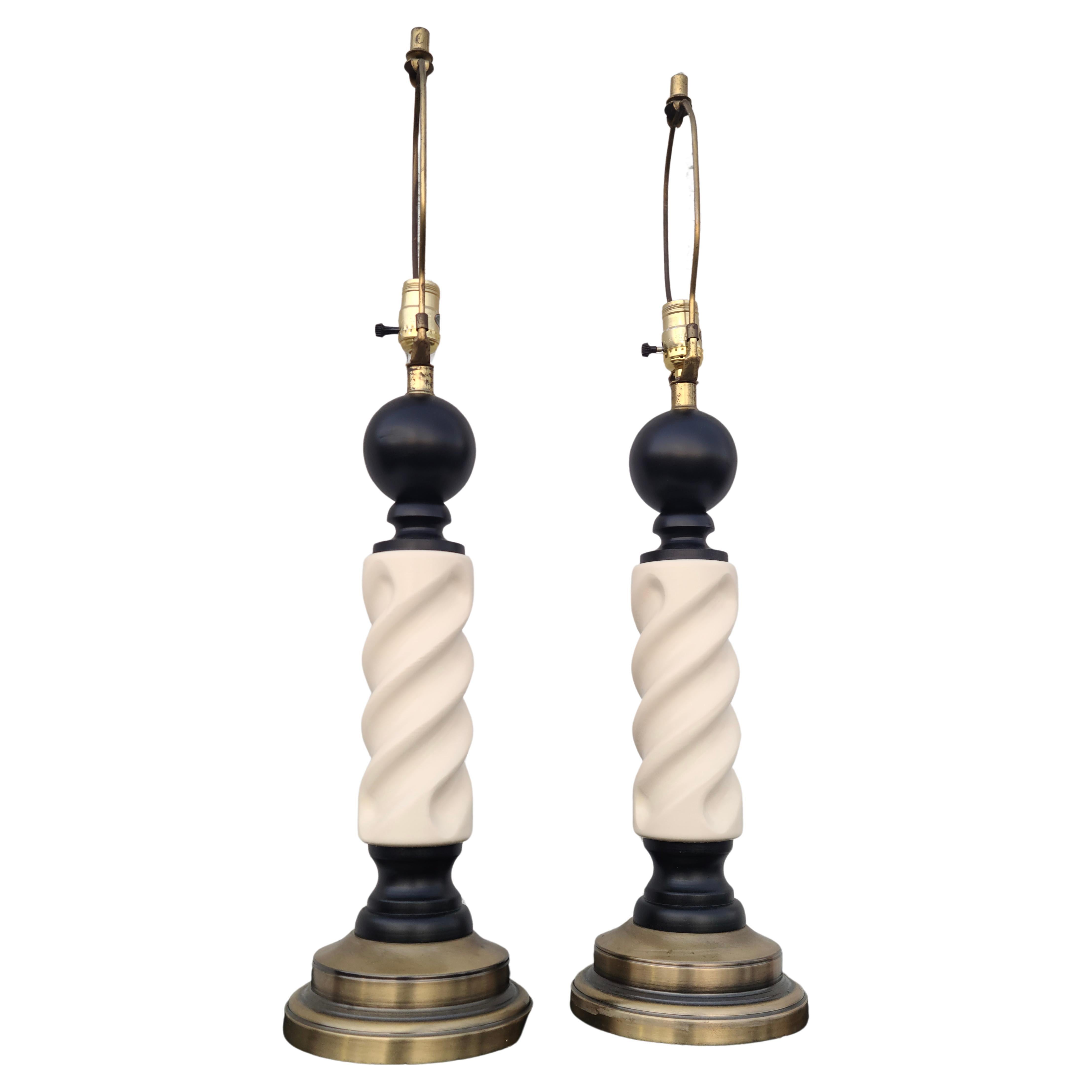 Pair mid-century decorative modern barber pole lamps.
Original antique brass wash base and fittings.
Lacquer has been refreshed.

Medium size body. 32