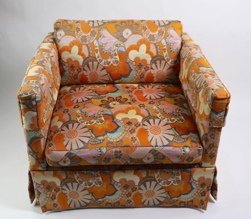 Stylish pair of cube form lounge, or club chairs marked Thayer Coggin, design attributed to Milo Baughman, fabric attributed to Jack Lenor Larsen. Classic form with exuberant and playful patterned fabric. Original clean condition, fabric shows minor