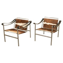 Pair Bauhaus Basculant LC1 Sling Armchairs Le Corbusier Cow Hide Cassina 1960s