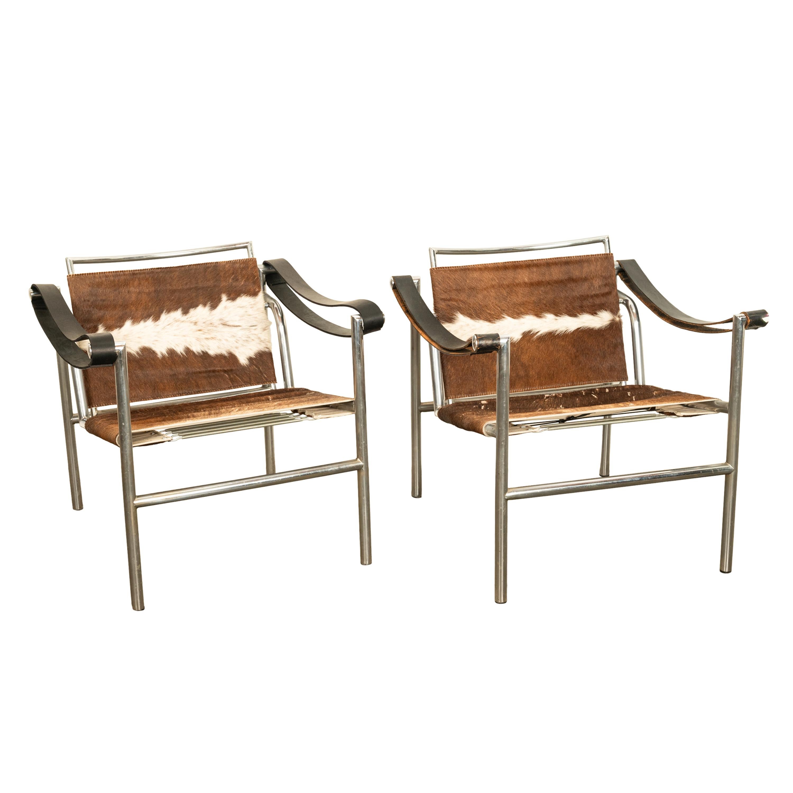Pair Bauhaus Basculant LC1 Sling Armchairs Le Corbusier Cow Hide Cassina 1960s In Good Condition In Portland, OR