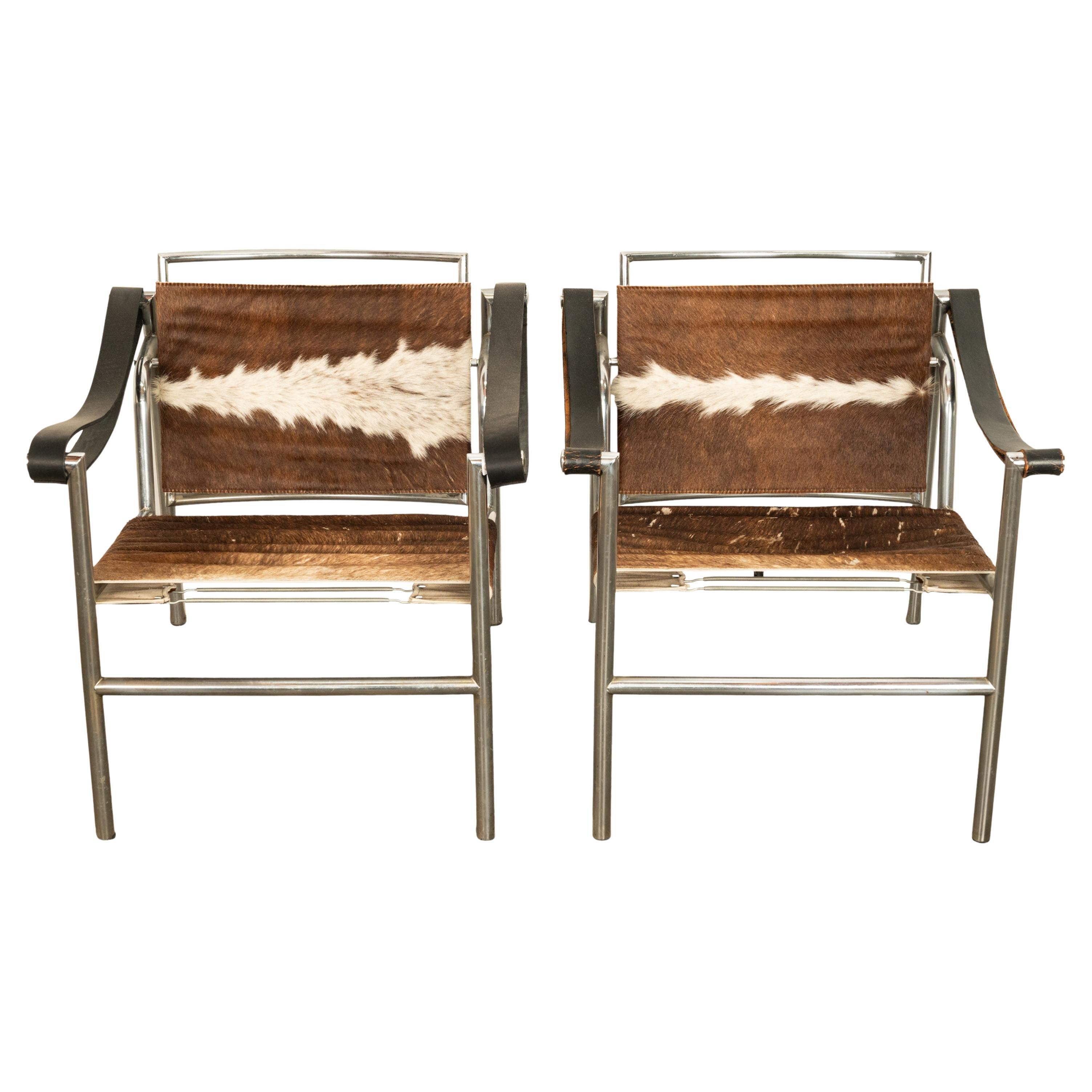 Pair Bauhaus Basculant LC1 Sling Armchairs Le Corbusier Cow Hide Cassina 1960s For Sale