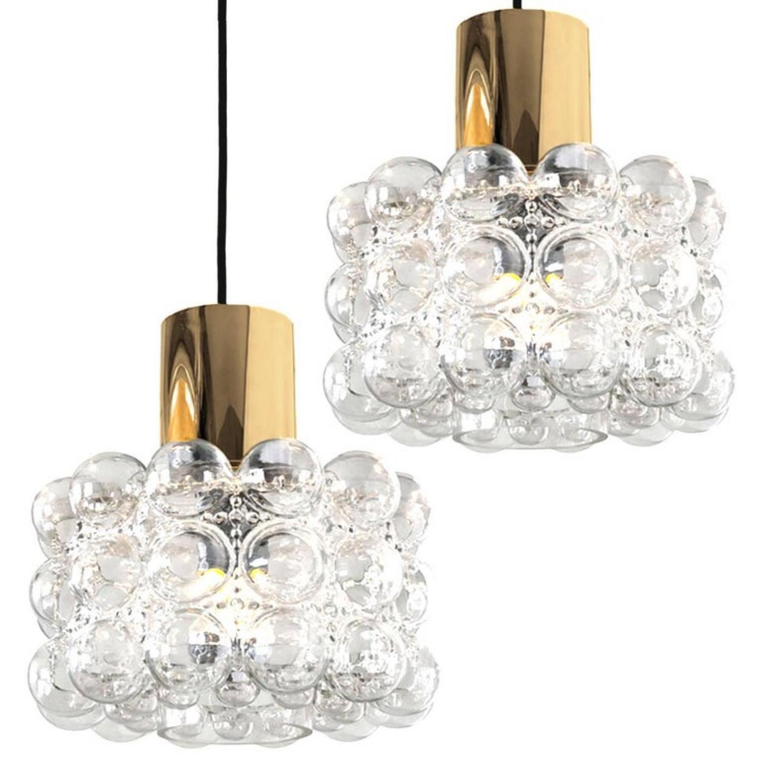 Pair of beautiful bubble glass chandeliers or pendant lights designed by Helena Tynell for Glashütte Limburg. A design Classic, the hand blown glass gives a wonderful warm glow.

The dimensions: Height 80 cm from ceiling, the diameter 30 cm. Height