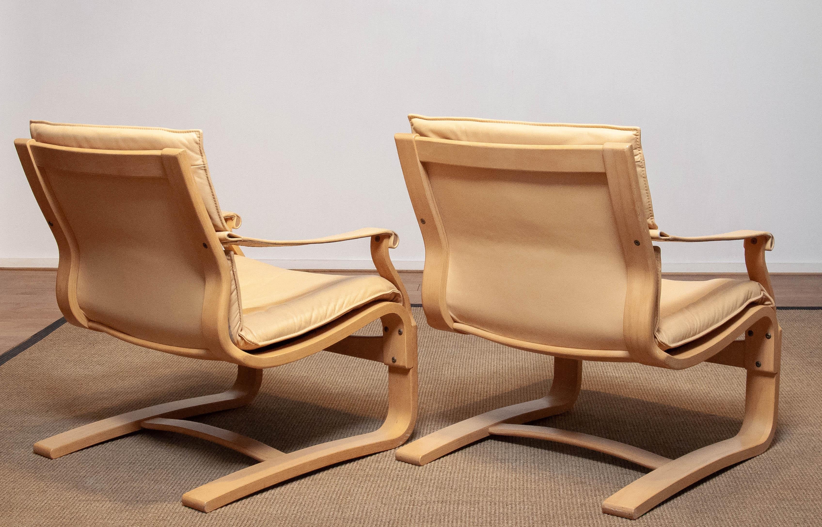 Pair Bentwood with Beige / Creme Leather Lounge Chairs by Ake Fribytter for Nelo For Sale 1