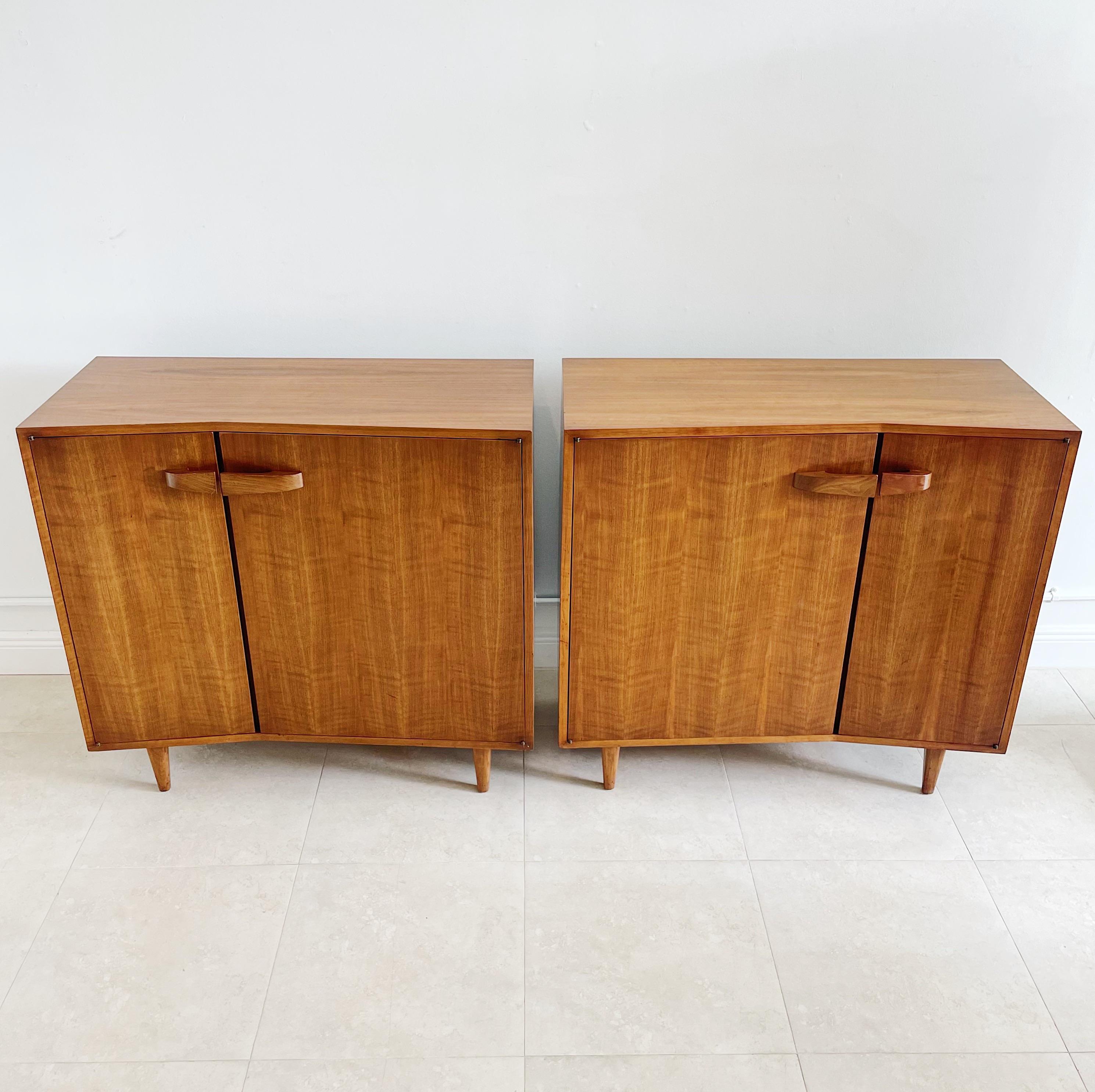 Rare pair of opposing Bertha Schaefer for Singer and Sons slant front, walnut chest of drawers cabinets. Each cabinet featuring six drawers and shelving in the interior. Originally purchased from the Singer and Sons Furniture Gallery in New York