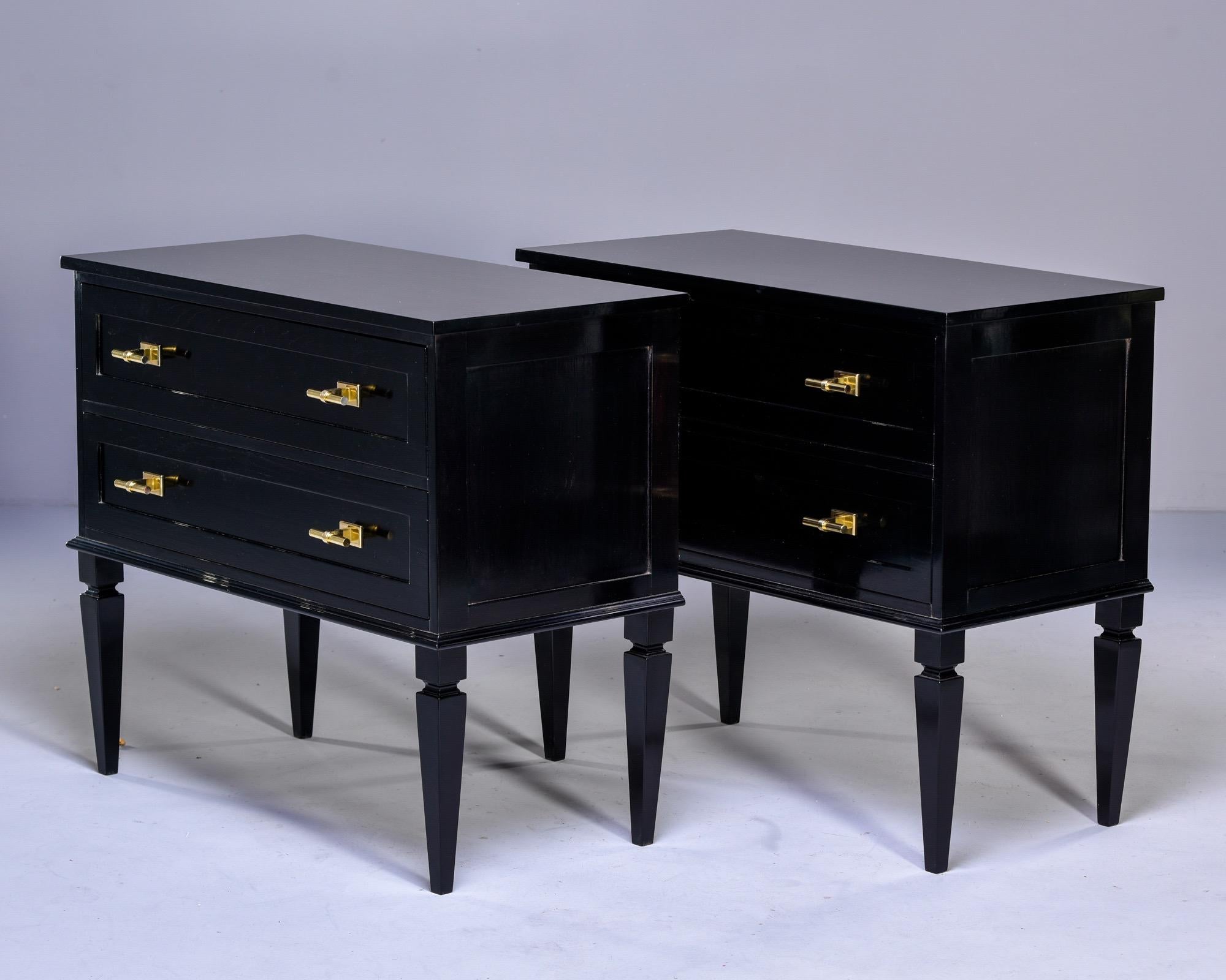 Custom made for us in England, this pair of two drawer chests is made from mahogany with an ebonized finish. Handsome brass hardware, dovetail construction, and tapered legs contribute to Classic and high quality style that pairs well with a variety
