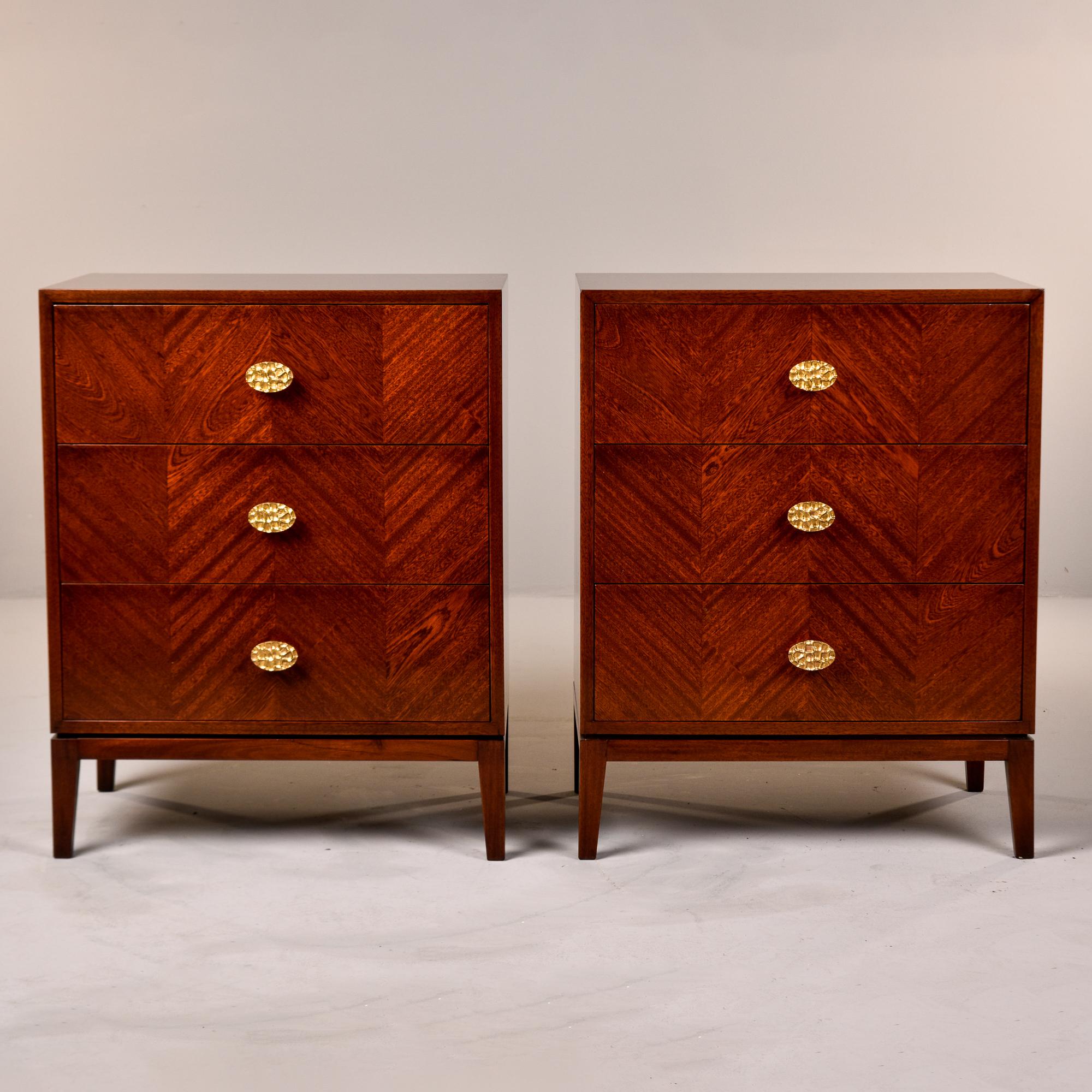 New and made for us in England, this pair of three drawer chests with walnut veneer would work well beside a sofa or bed. Classic shape with slightly tapered legs and a subtle decorative herringbone pattern on drawer fronts created by alternating