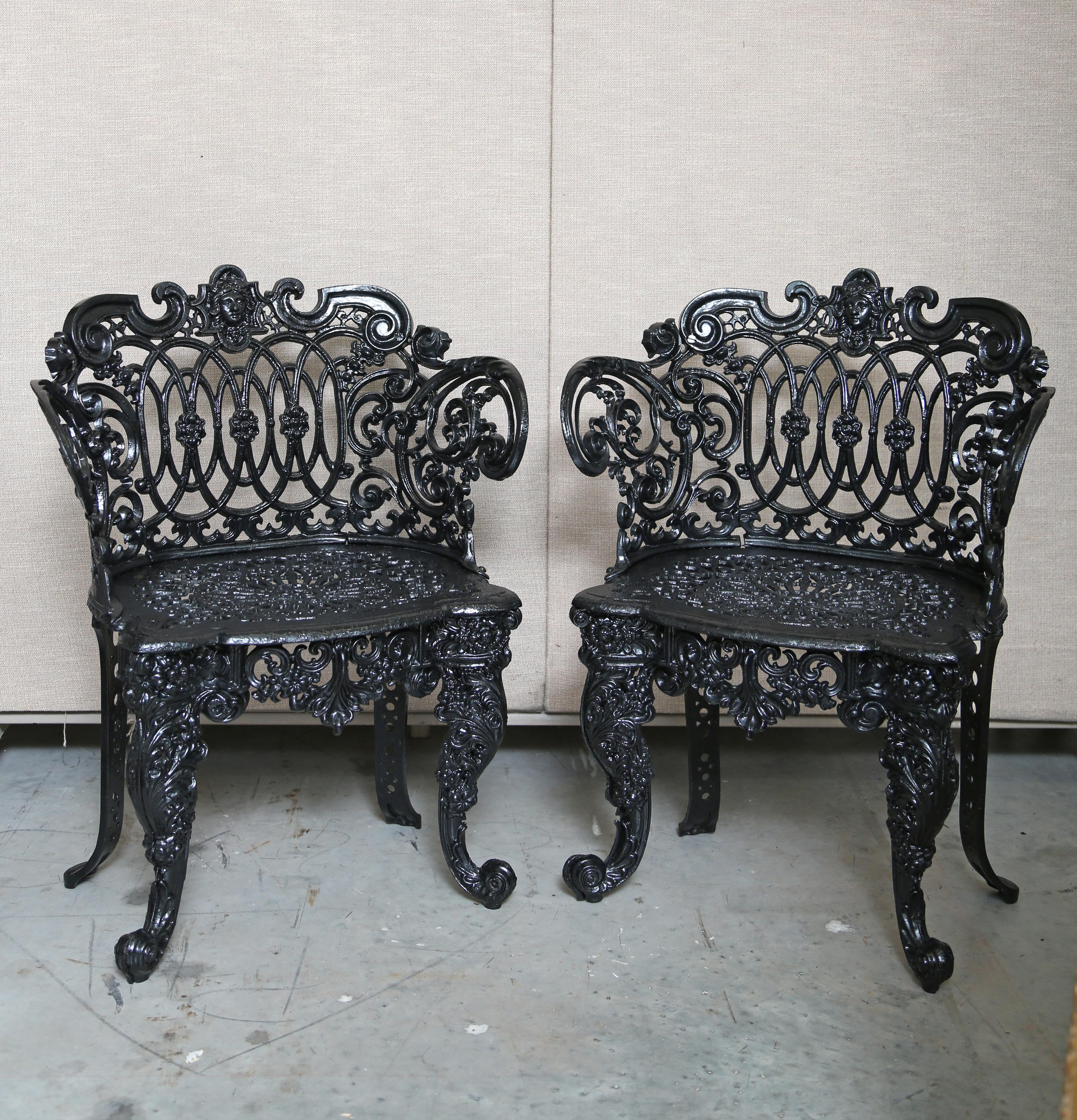 Pair Betsy Ross pattern Victorian cast iron garden chairs. The iron work is superb with the face of Betsy Ross in the center back. Rolled arms and scrolled legs define this bench. This pattern is desirable and hard to find. They have been restored