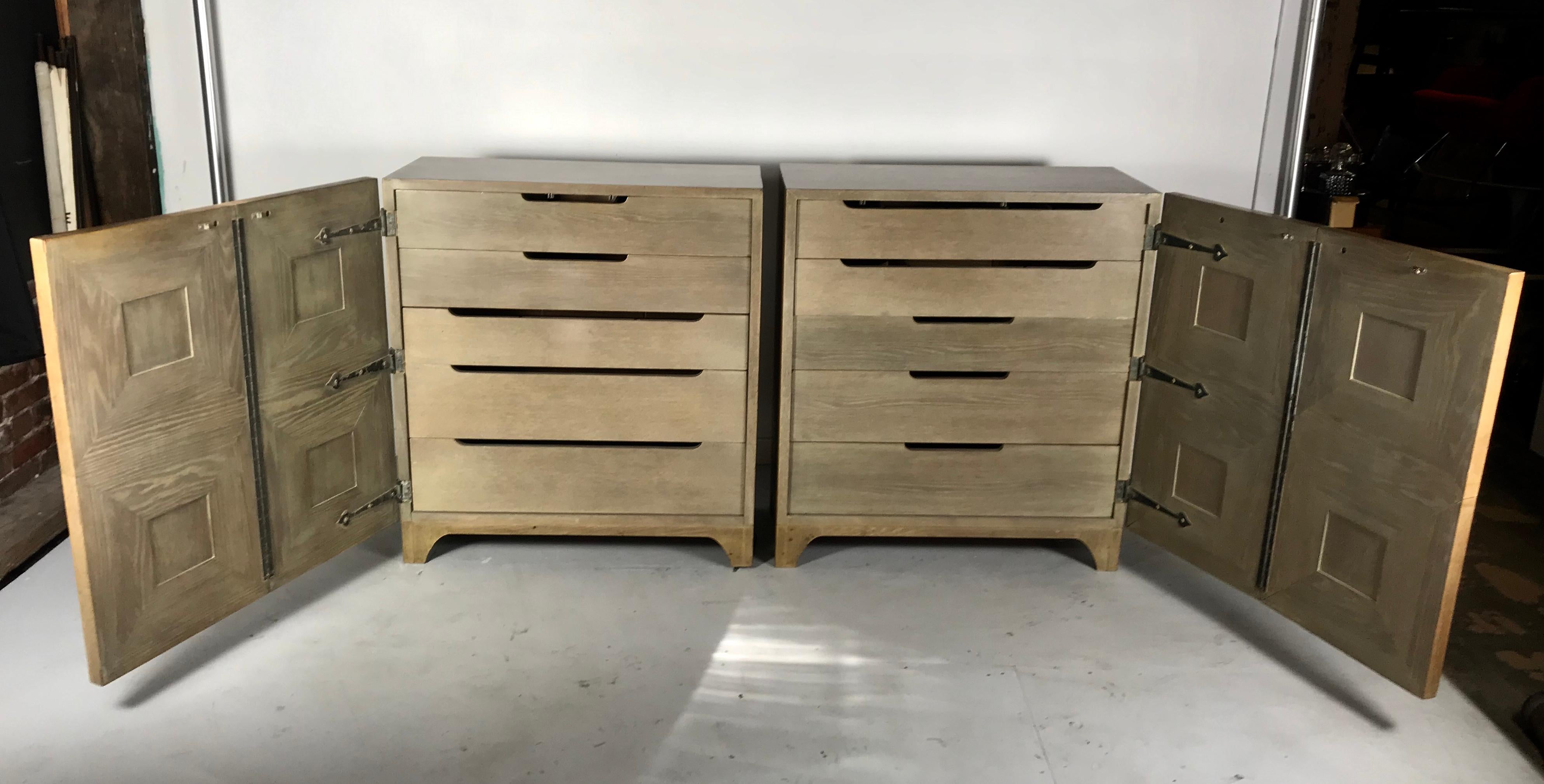 Stunning pair of Bi-fold panel front 5-drawer Cerused oak dressers by Romweber Furniture Co. Regency modernist design. Superior quality and construction, amazing design and proportions. Retains original color, surface, patina. Five generous divided