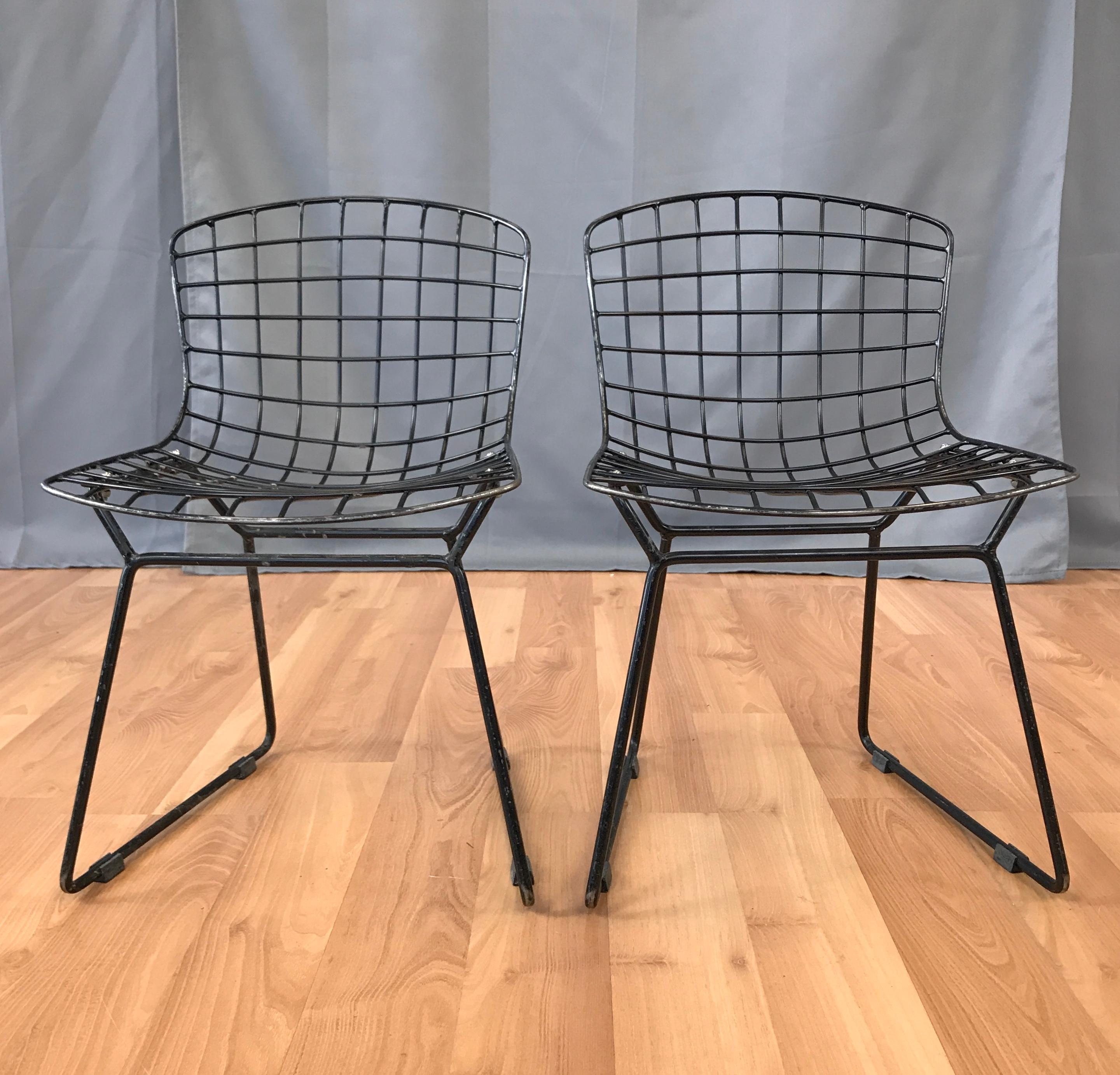 Offered here are a pair of Black Bertoia chairs for Knoll. They are small child size, would say up to 8 years.