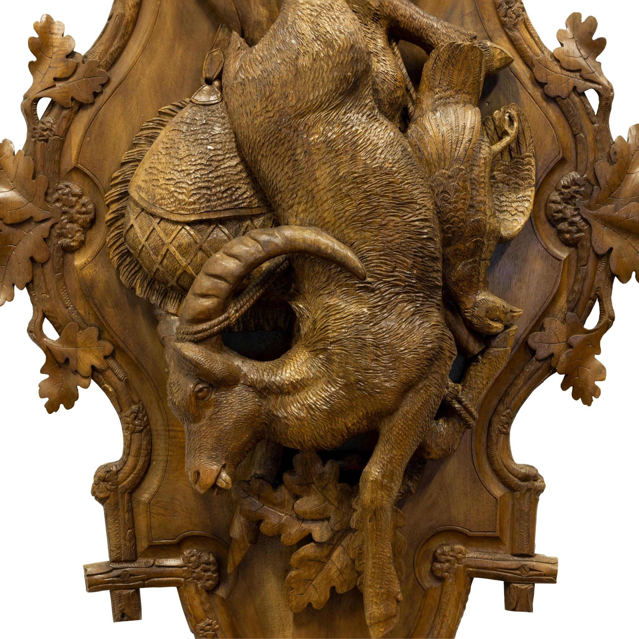 Matched pair of Black Forest linden wood hanging game plaques. One with chamois and grouse, the other red stag and fox. Both complete with rifle and game bags. Part of the Brienz Collection but not published.

PERIOD: Circa 1900
ORIGIN: Swiss
SIZE: