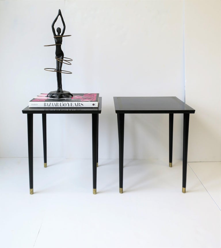 A small chic pair of early to mid-20th century black lacquer square wood tables with gold Greek-key design, and an Italian Midcentury Modern look, circa 1940s, Brooklyn, New York. Tables can work as end tables, side tables, drinks tables,