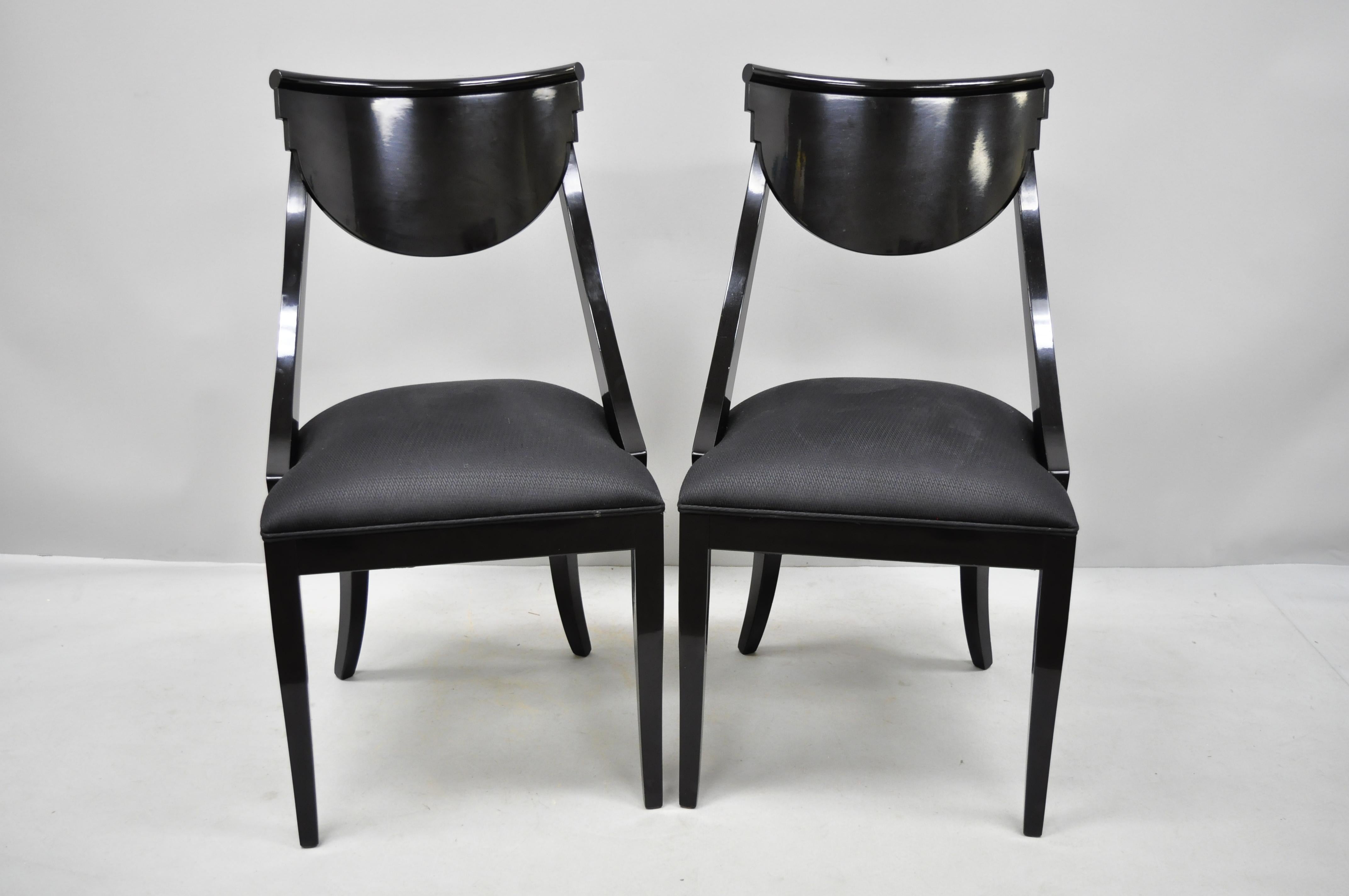 Pair of black lacquer Italian Hollywood Regency style side chairs by Pietro Costantini. Items include glossy black lacquer finish, solid wood construction, original label, shapely saber legs, great style and form, circa late 20th century.