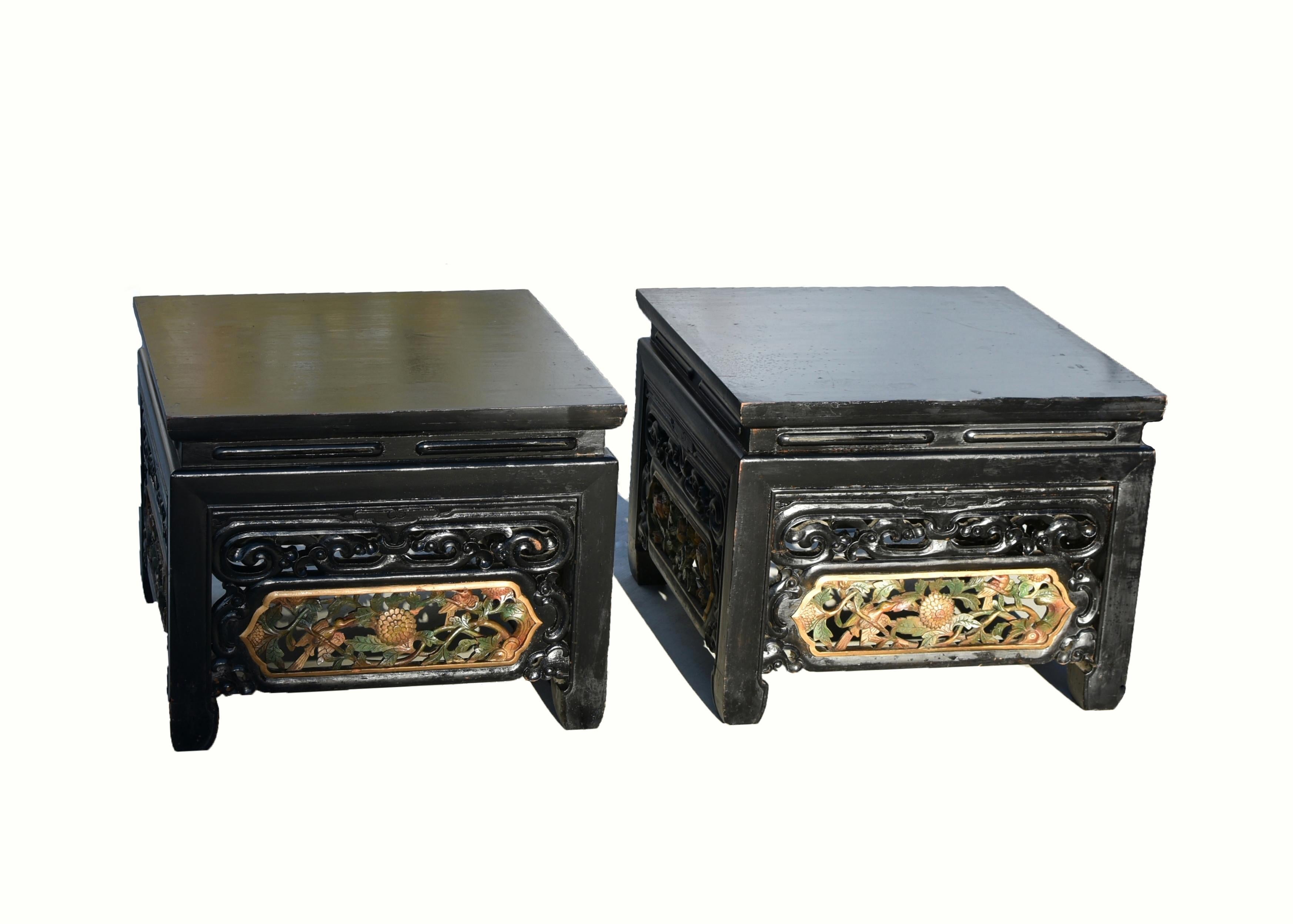 An exceptional offer of value on this pair of beautiful, fully carved solid wood low tables. Solid single board top connects to a narrow waist continuing on to straight legs with hoof feet. The waist is carved with thin slits of 