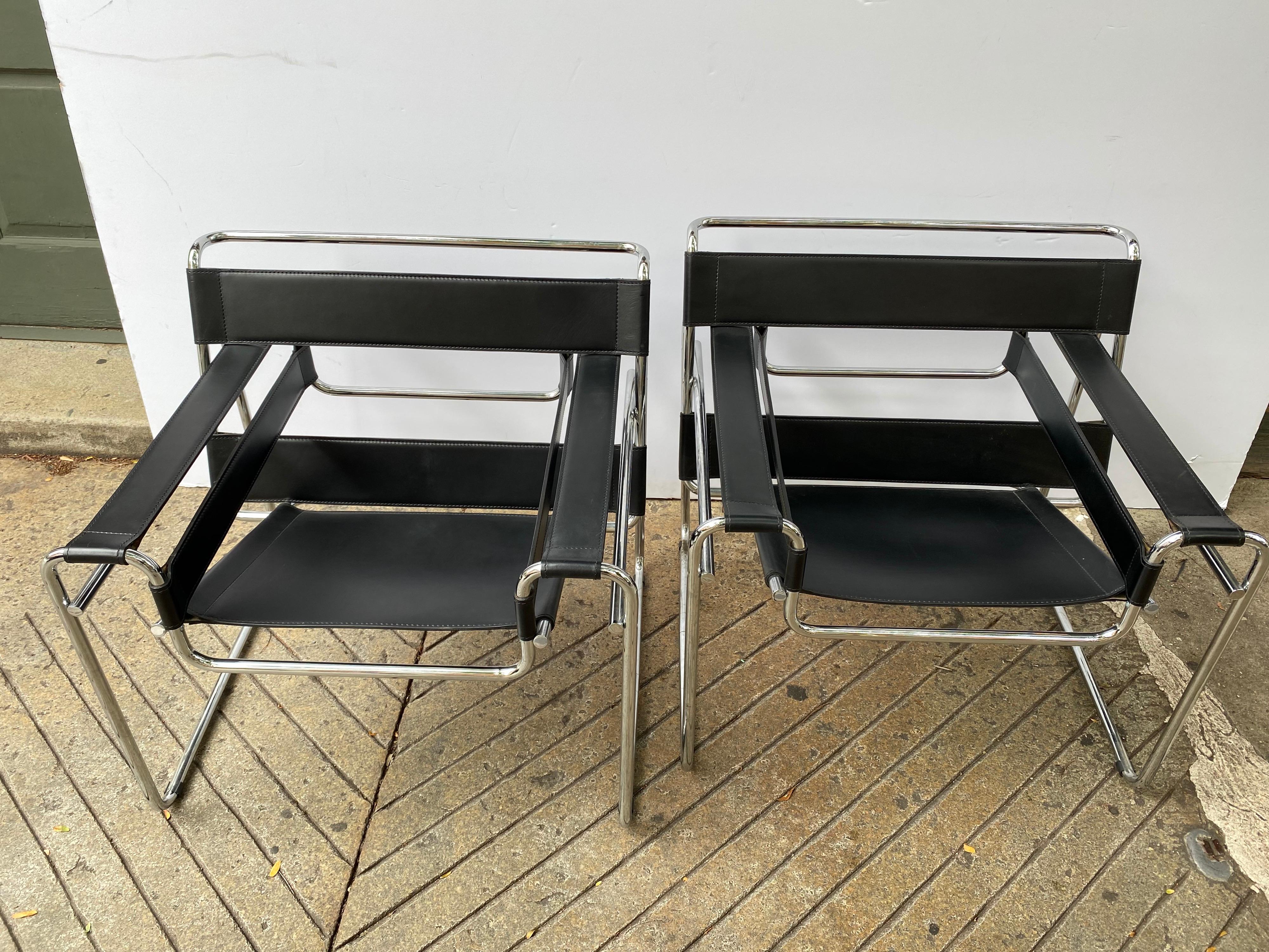 Marcel Breuer Classic 1925 design! chair has been produced off and on since it's creation! Black Leather and Chrome are very Clean! I would date this pair to 2000? Roughly 15-20 years old. Unmarked but nice quality with finished caps and nicer
