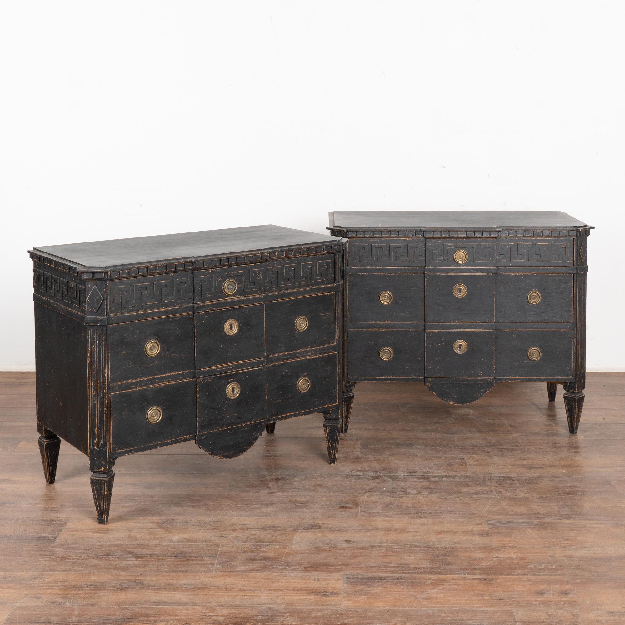 A pair of Gustavian pine chest of drawers with canted fluted side posts with upper carved diamond medallion, Greek key meander along top drawer, upper dentil molding and all raised on four tapered fluted feet.
The newer, professionally applied