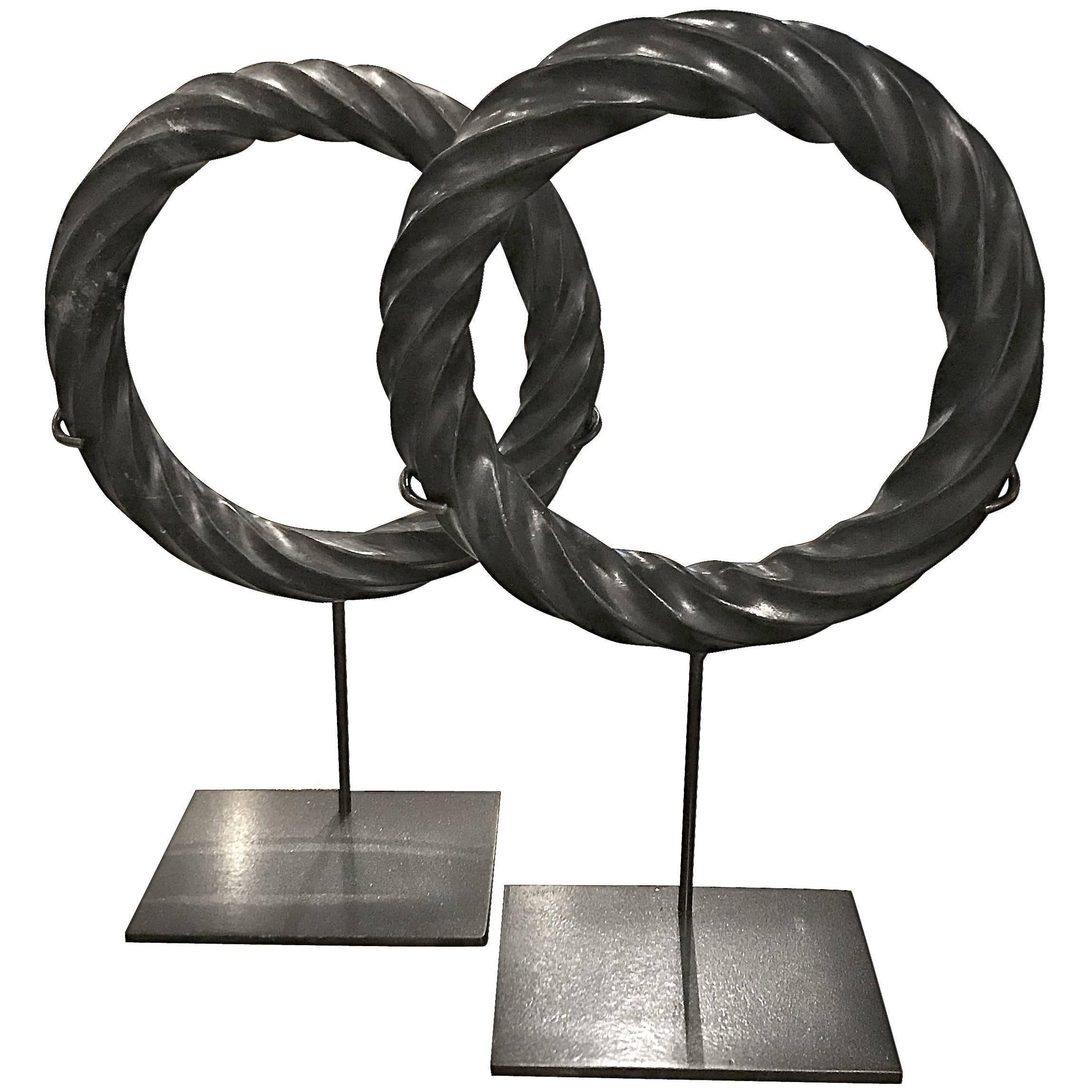 Pair of Black Twisted Marble Ring Sculptures on Stands, China, Contemporary