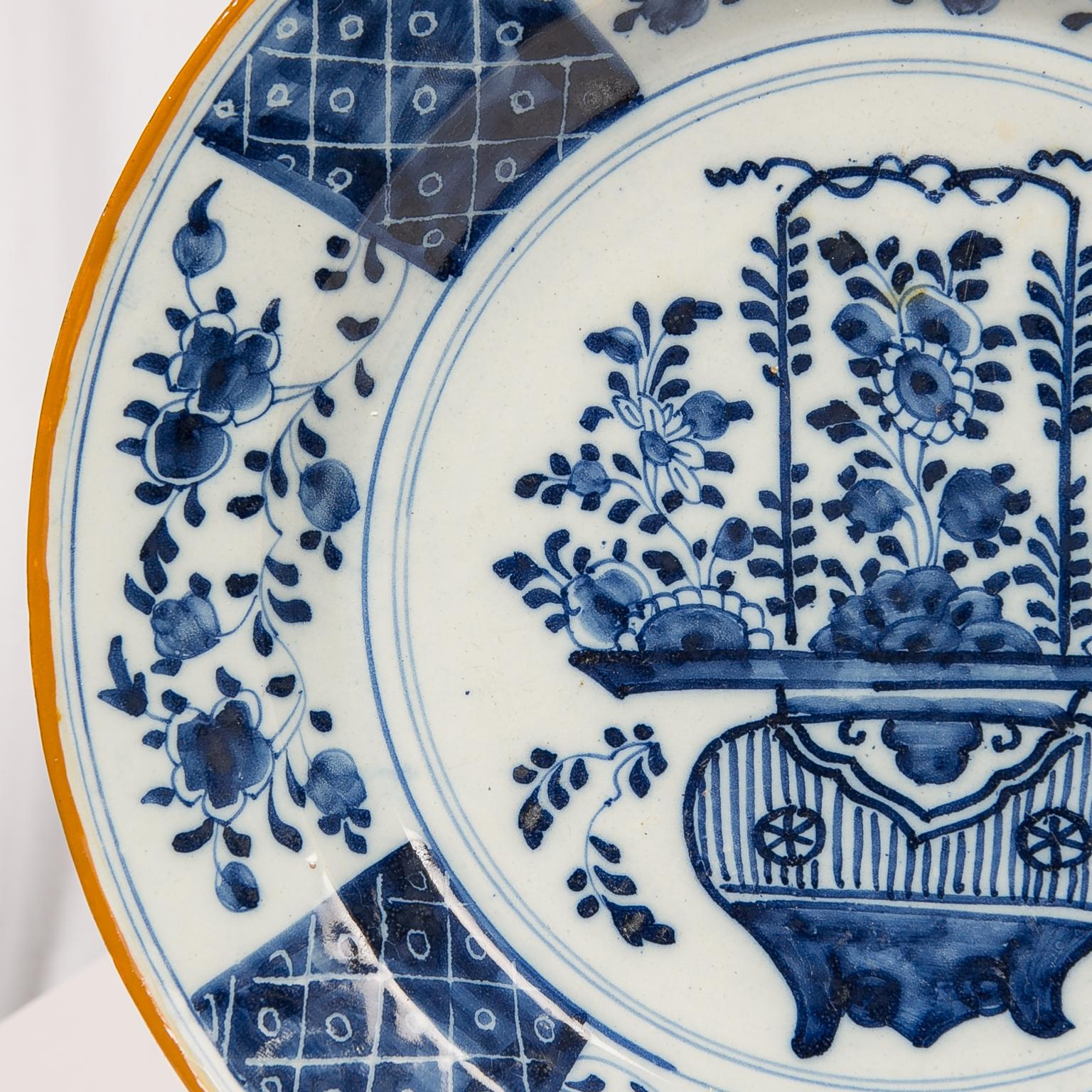 Hand-Painted Pair of Blue and White Delft Chargers Showing a Flower Filled Vase circa 1780