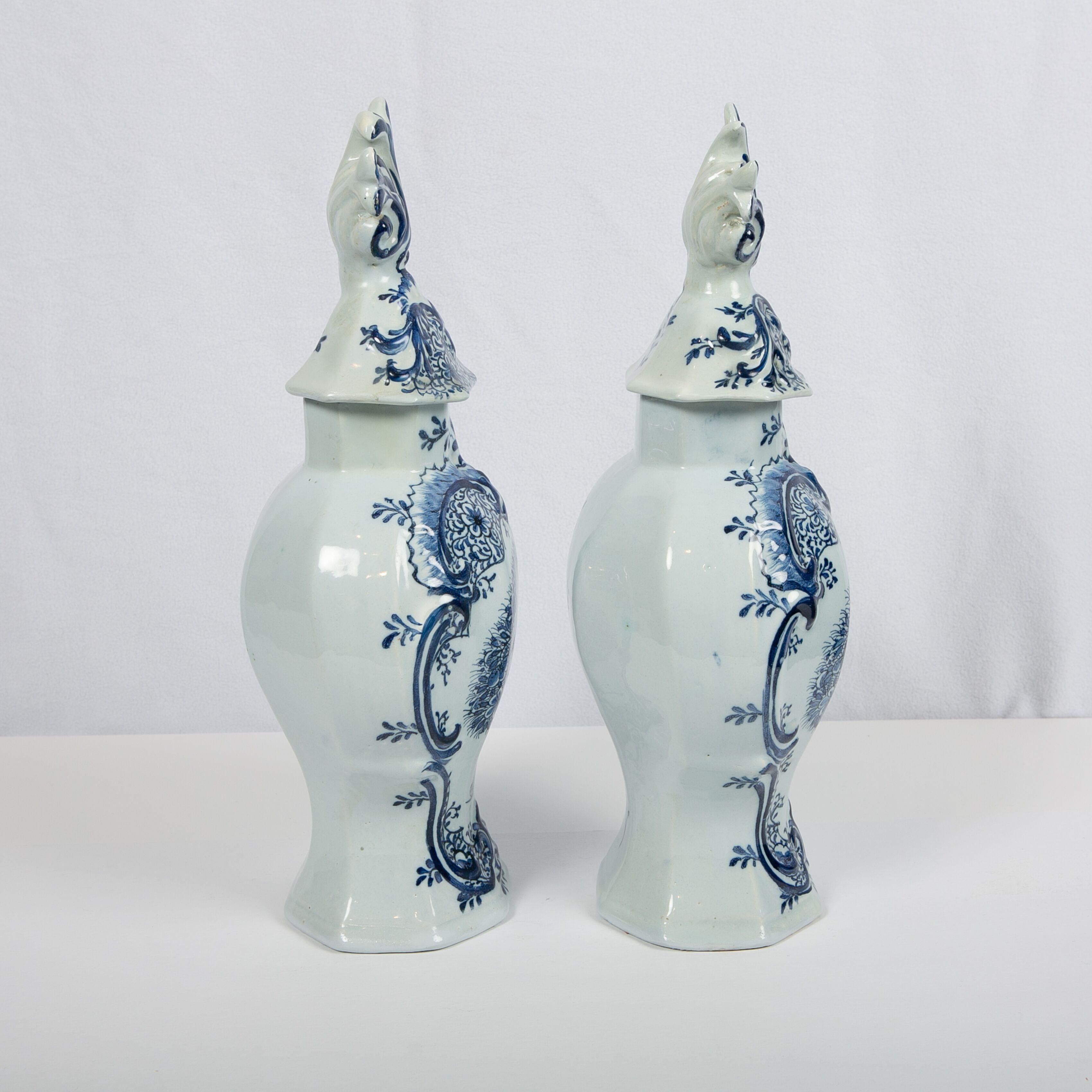 This pair are large for mantle vases. These blue and white Dutch delft mantel (fireplace) jars were made by 