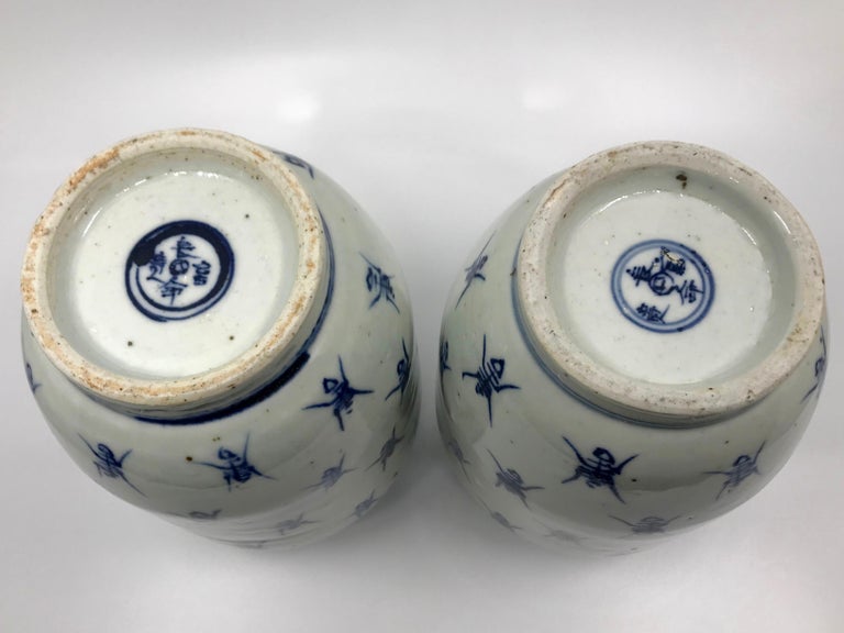 Pottery Pair of Blue and White Ginger Jar Vases For Sale