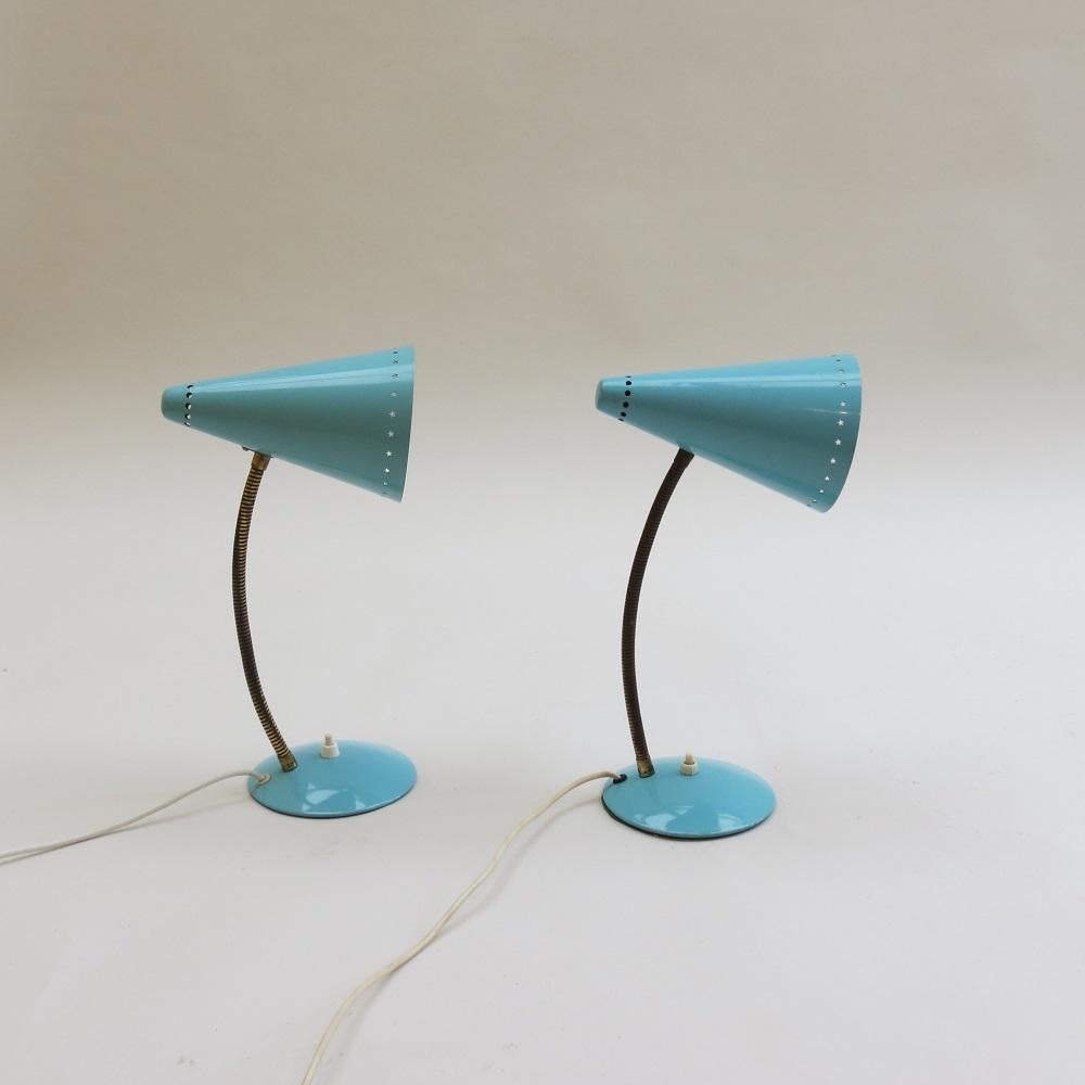 Wonderful pair of original 1950s metal desk lamps. Enamelled metal shades and bases, with brass adjustable goose neck arm allowing the lamp to be adjusted to various angles. In good original vintage condition, one shade has a small mark to the shade
