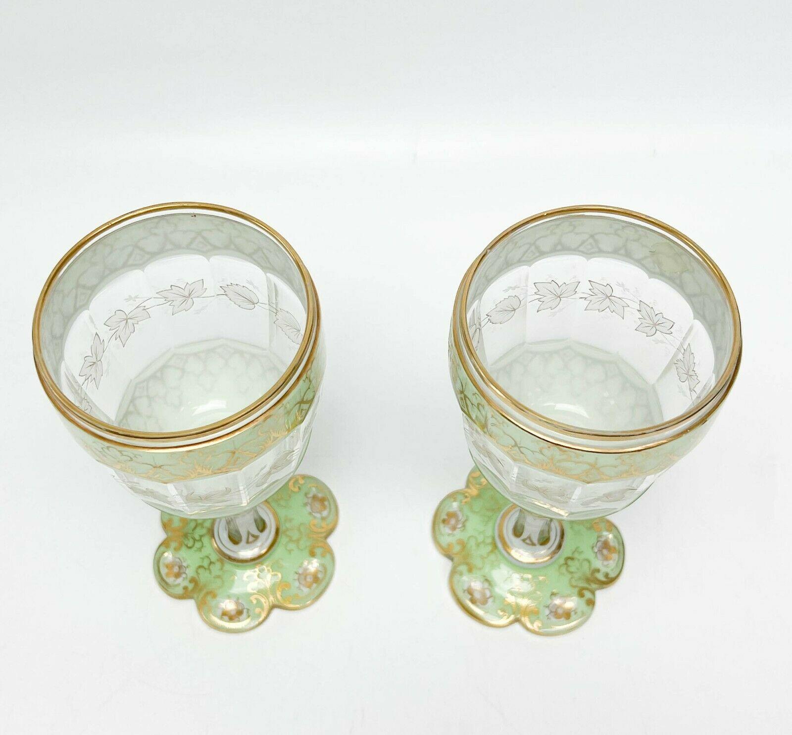 Pair bohemian 3 layer green white cut to clear glass goblets, 19th century.

Bowls with 3 layer green and white glass with cut to clear panels, stem with 2 layer white cut to clear panels. Bowl stem and base were all blown separately. Stem with