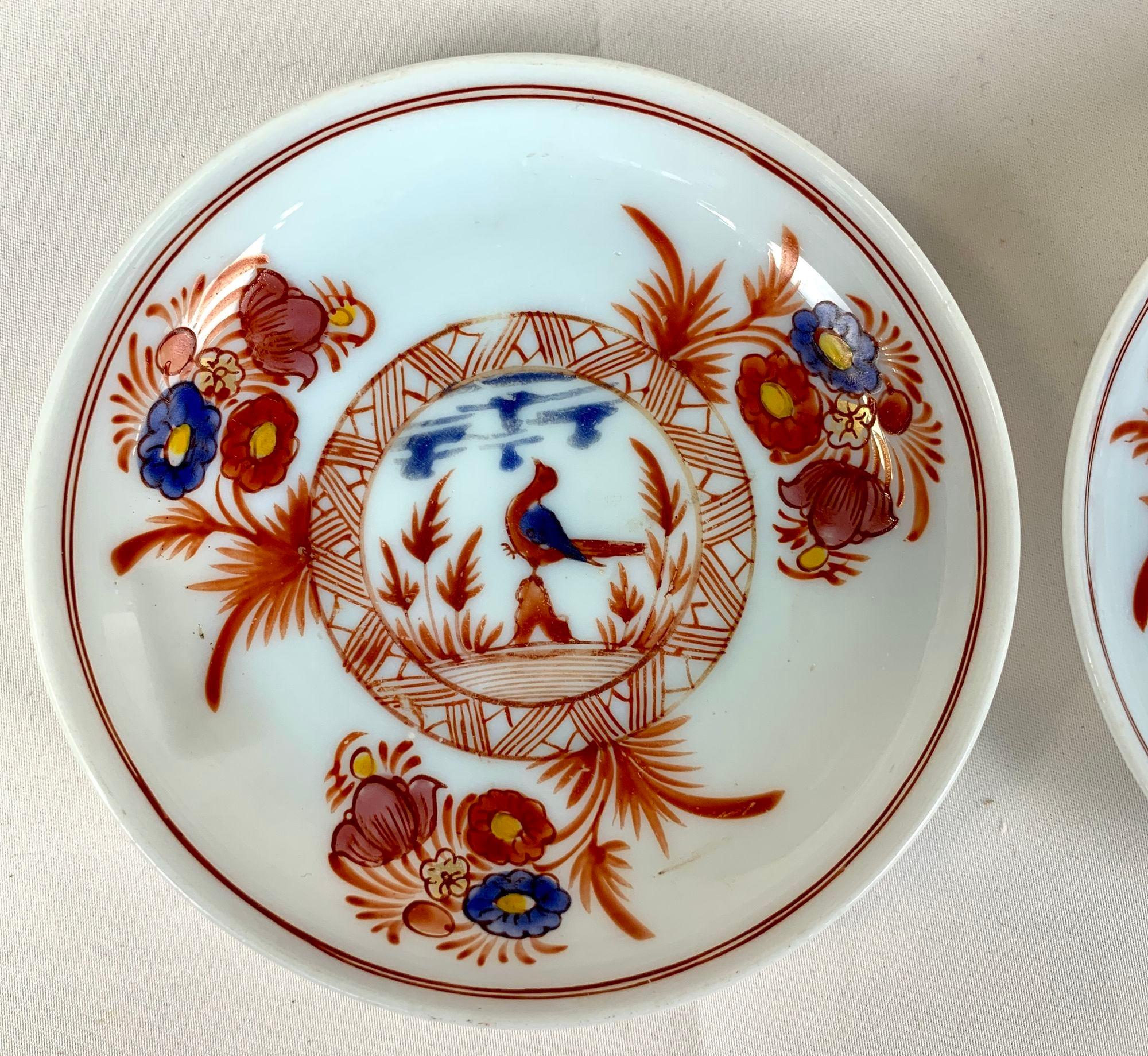 Hand blown circa 1860 this pair of Bohemian Glass saucers are little gems! .
We see a long-tailed songbird standing on rockwork, tilting his head up to sing his song out into the sky.
Around him are red leafy plants, and above is a blue sky all