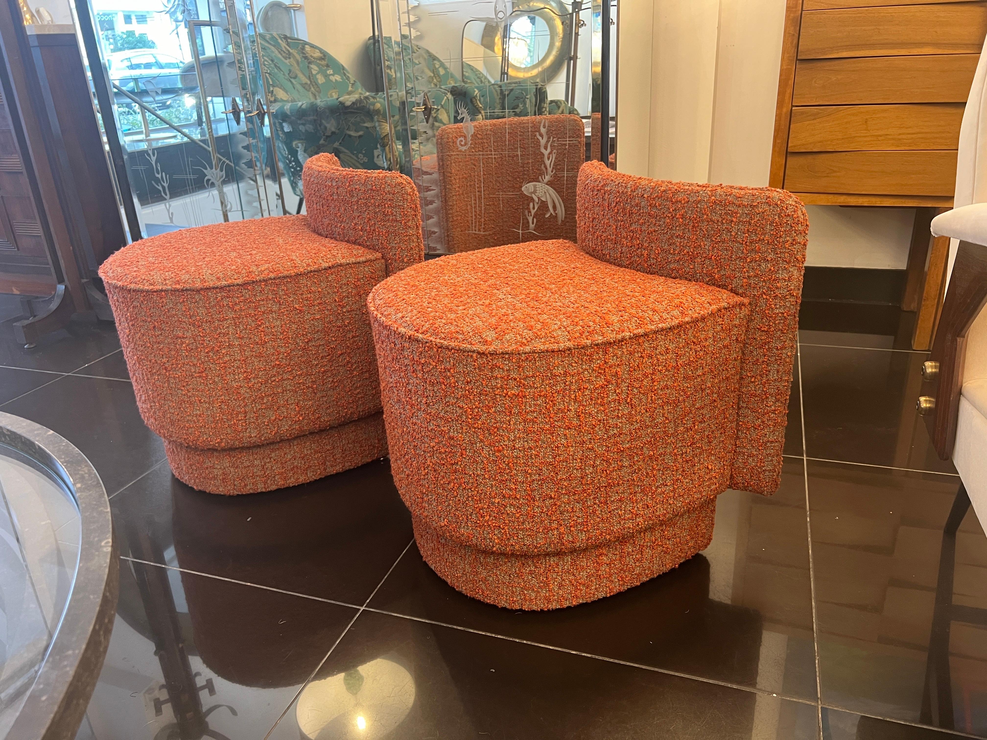 A beautiful pair of low cocktail chairs with semi curved back rests newly upholstered in salmon boucle fabric. 
C1960s
Italy 