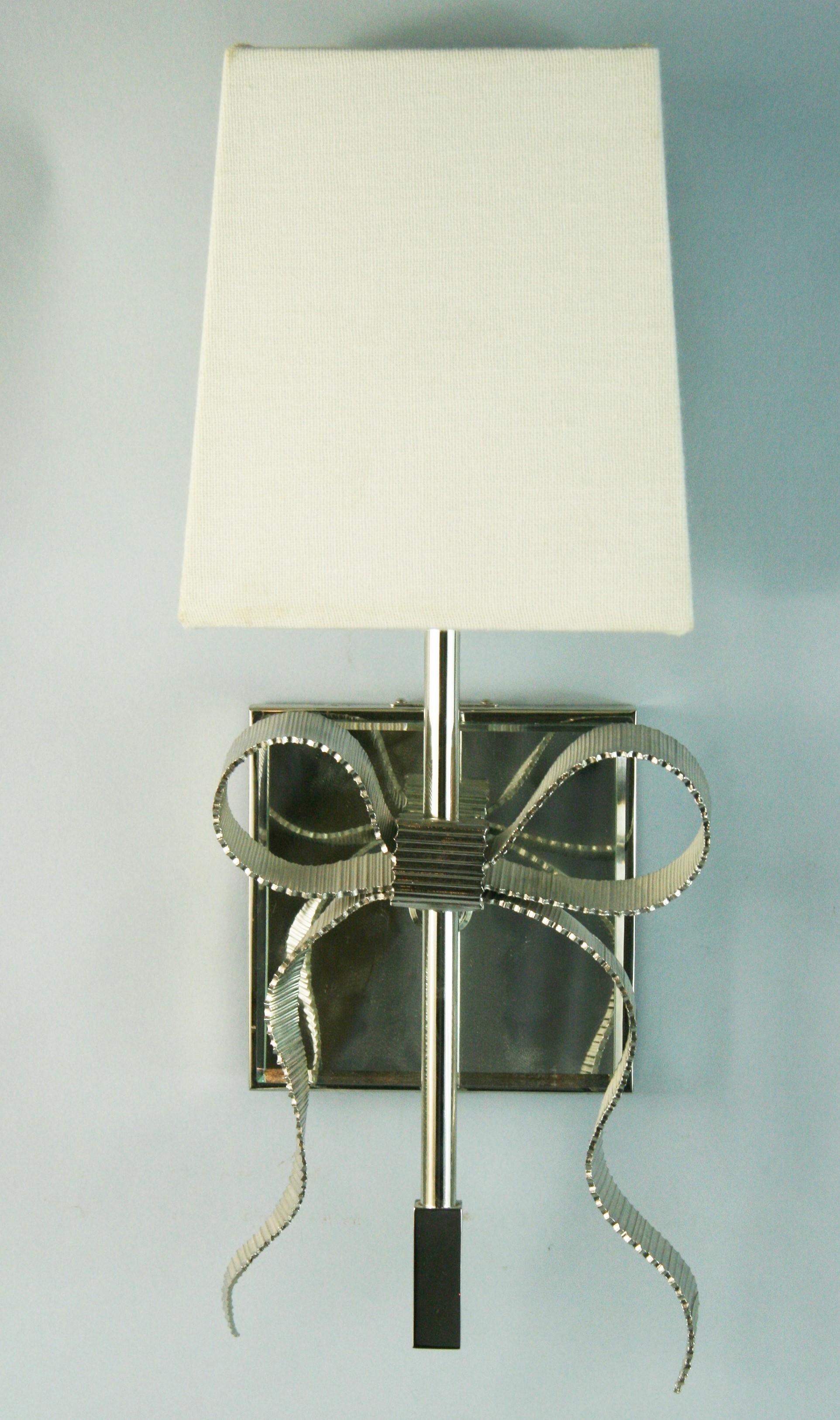 1670 Pair mirrored bowe tie sconces designed by Kate Spade for Intertek 2012