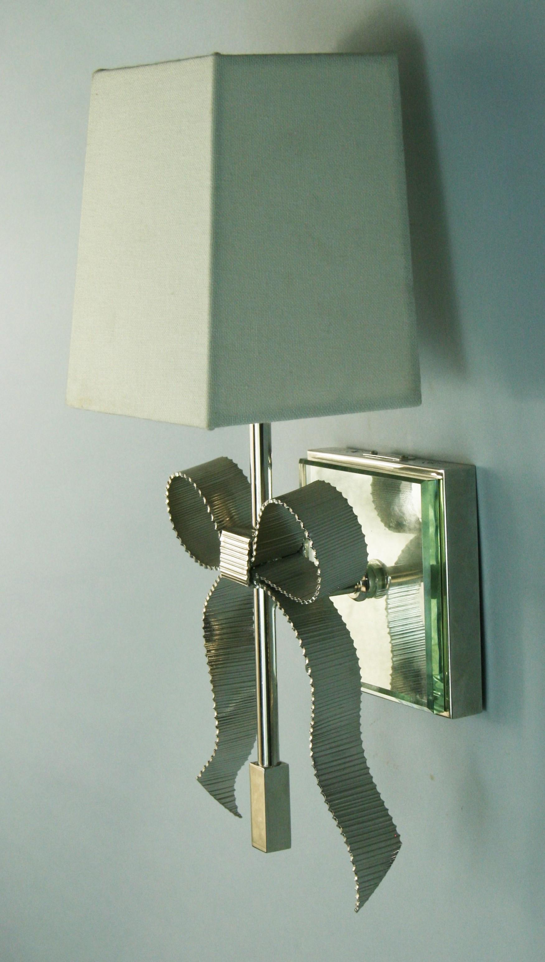 Brass Pair Bowe Mirrored back sconces Designed By Kate Spade for Intertek Circa  2012 For Sale