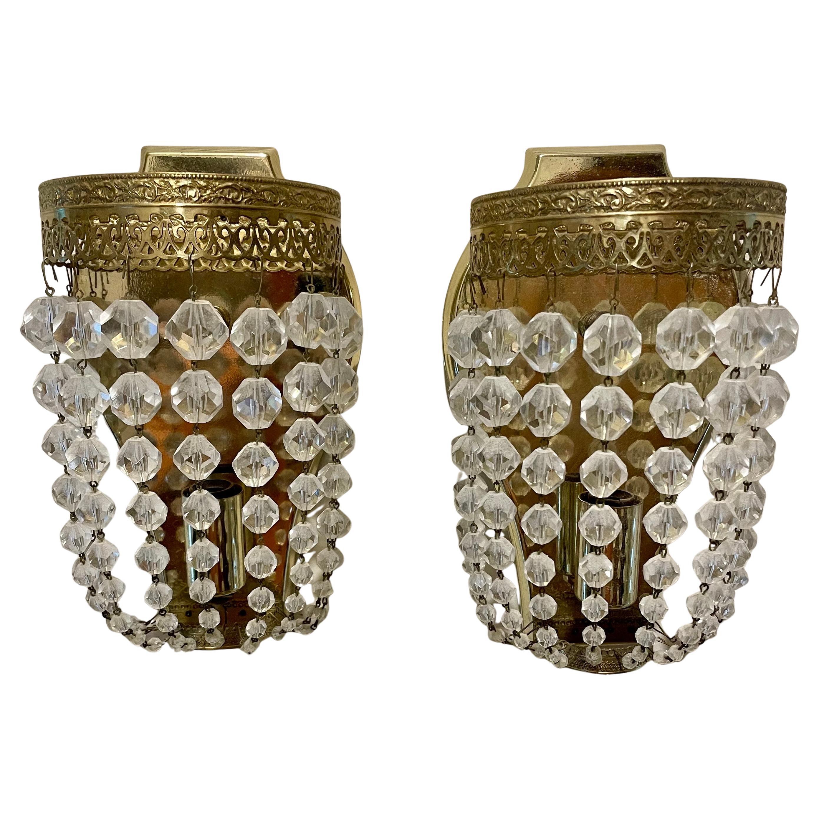 Paire d'appliques en laiton et cristal
