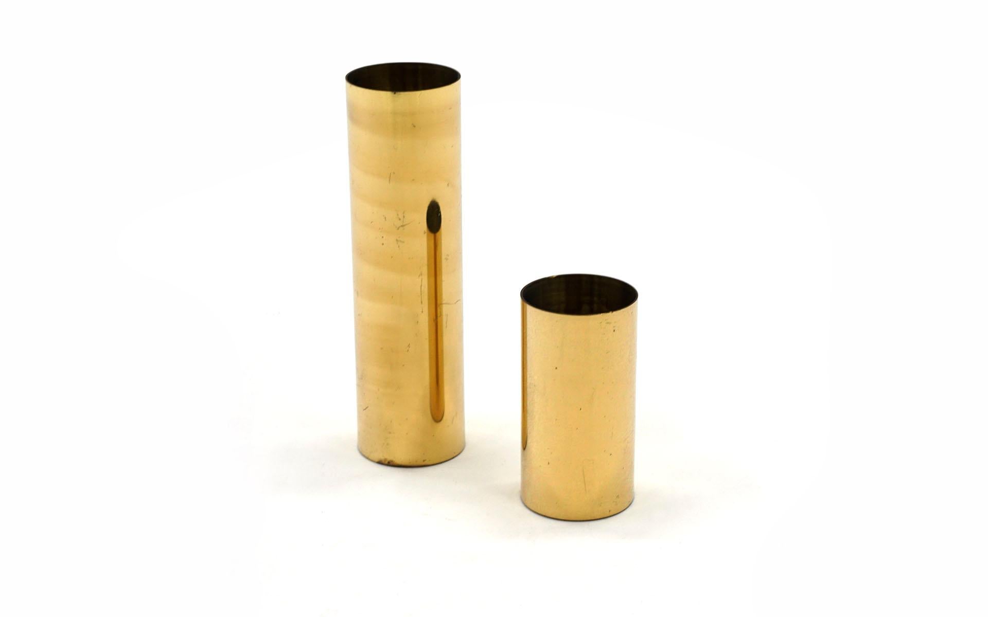 Complimenting pair of brass cylindrical candle holders in very good condition with nice patina.