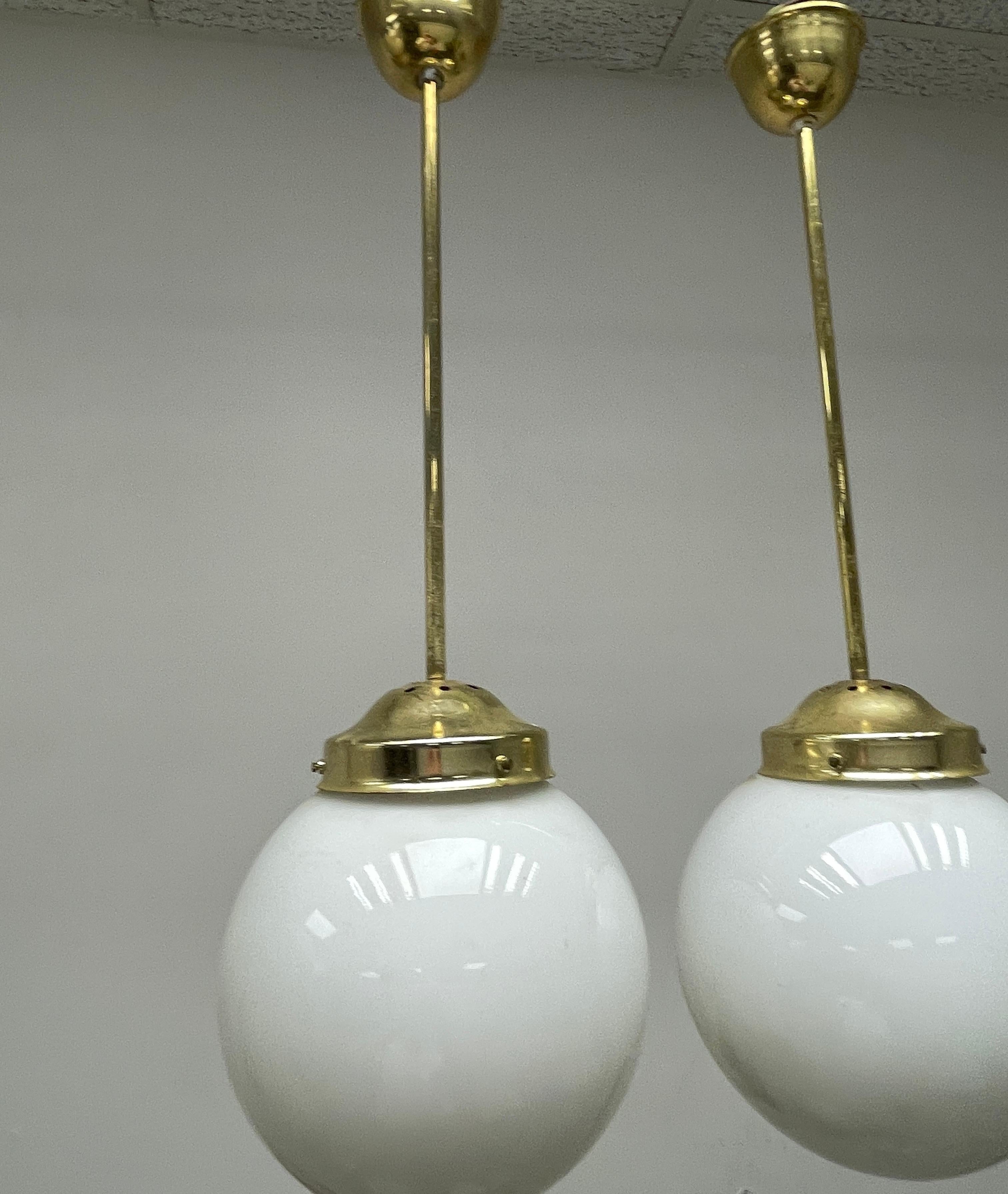 Austrian Pair Brass Fixture Pendant Milk Glass Ball Art Deco Style Vintage, Austria For Sale