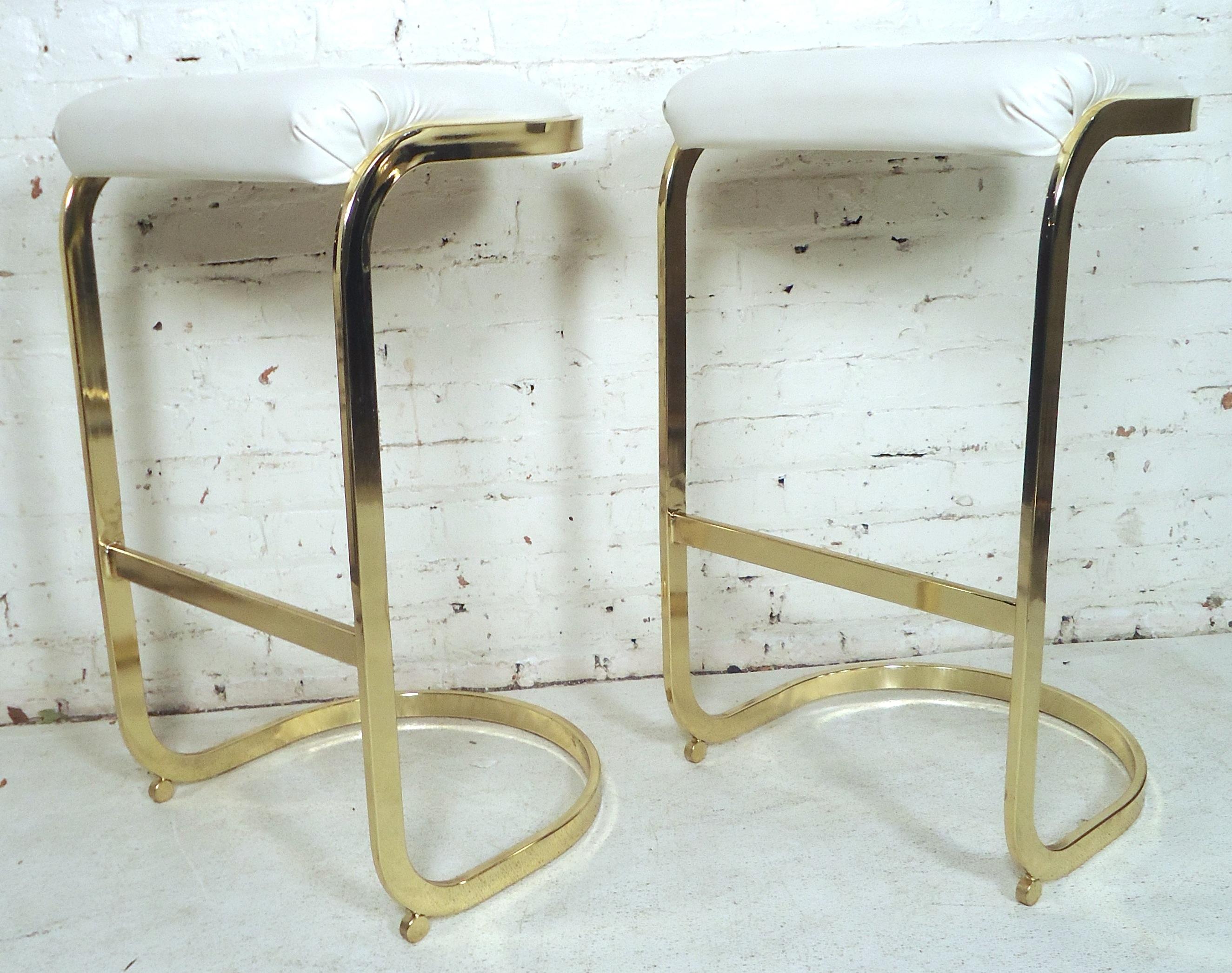 Mid-Century Modern stools with polished brass frame and white seats.

(Please confirm item location - NY or NJ - with dealer).
    