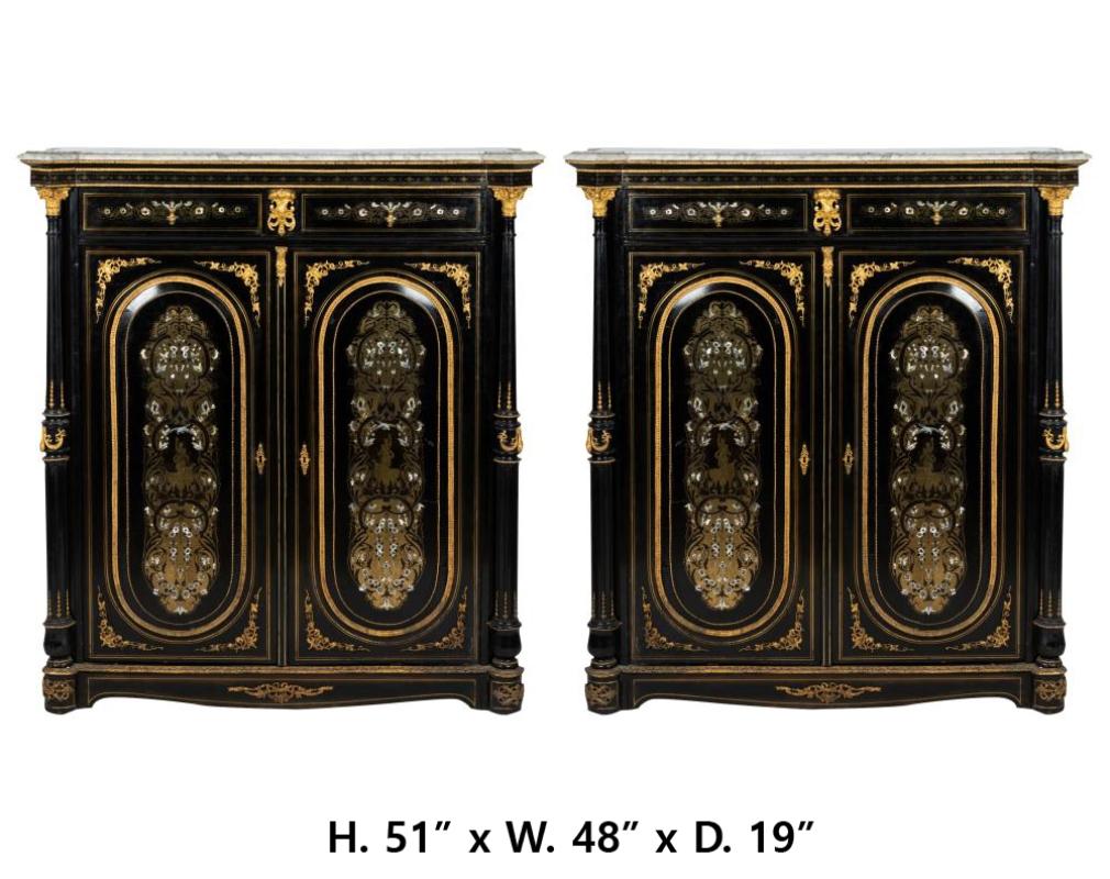Exceptional pair of French 19 century mother of pearl and brass inlaid ebonized two door cabinets with Carrara marble tops.
Late 19 century.
The carrara marble tops over a frieze with two drawers above two beautifully inlaid doors.  
Meticulous